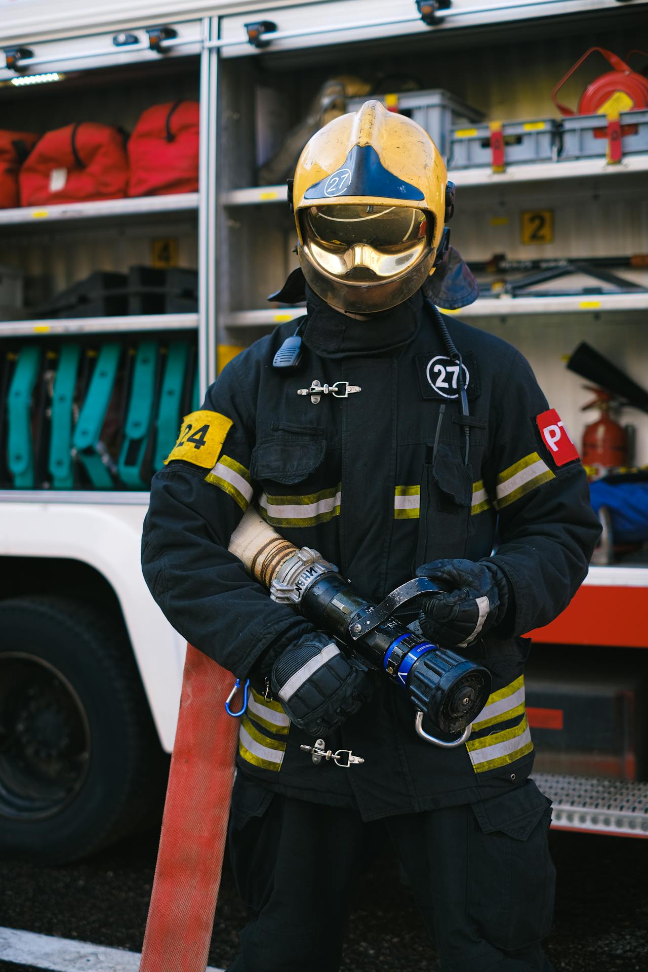 A firefighter with his equipment | Source: Pexels