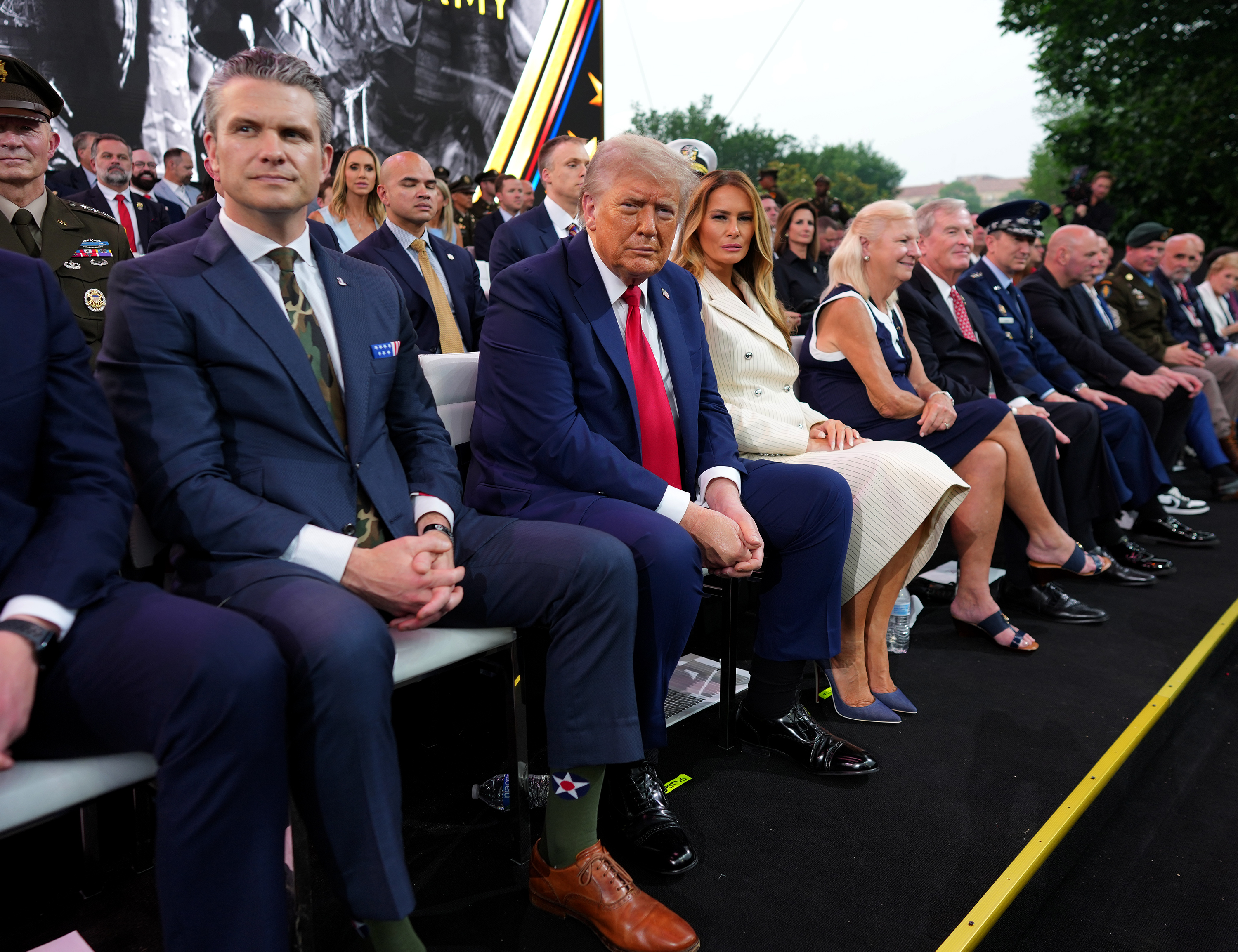 Secretary of Defense Pete Hegseth, President Donald Trump and First Lady Melania Trump look on during the celebration of the Army's 250th birthday on the National Mall on June 14, 2025 in Washington, DC. | Source: Getty Images