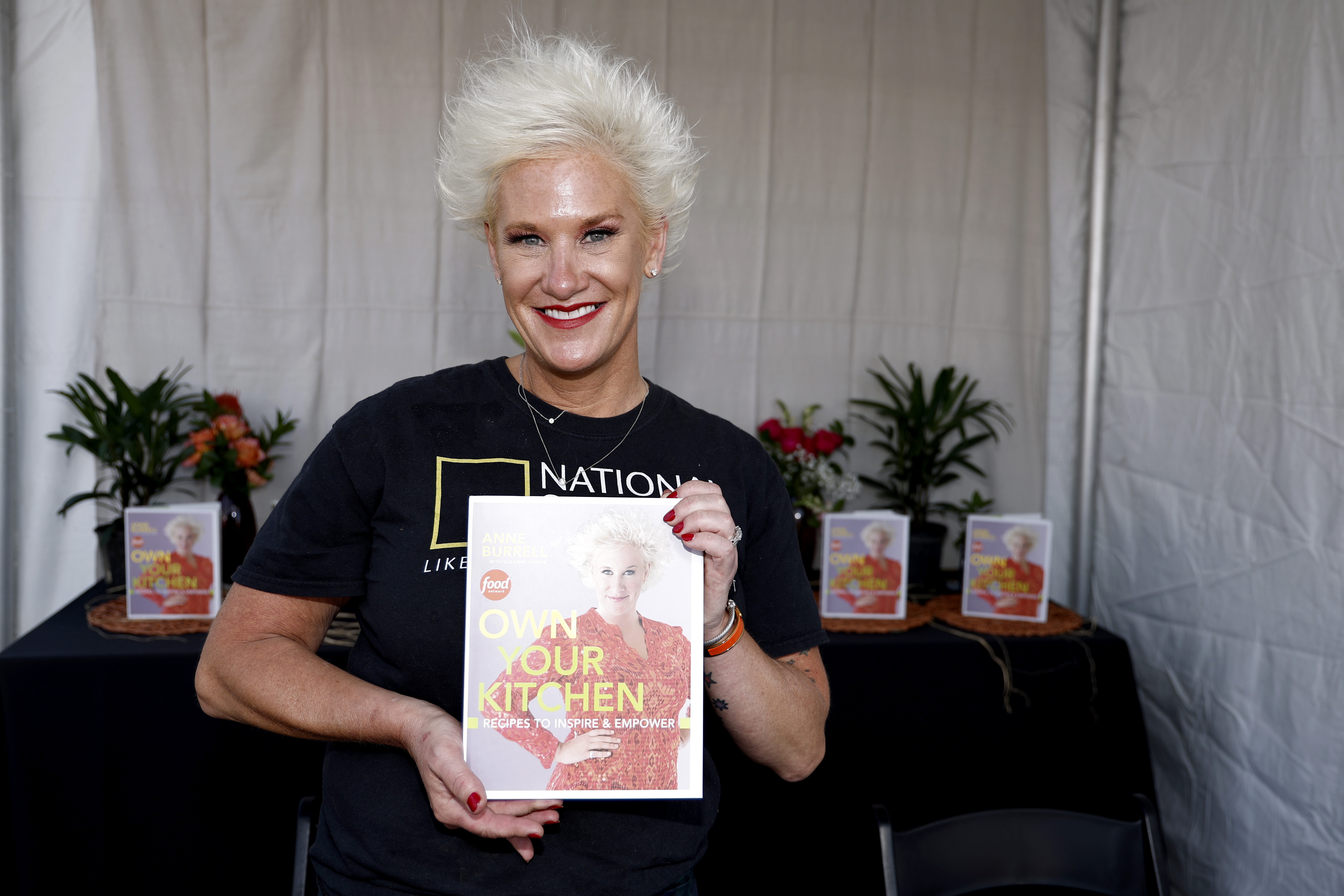 Anne Burrell poses during a book signing at the Food Network New York City Wine & Food Festival presented by Capital One - Grand Tasting featuring Culinary Demonstrations presented by Liebherr Appliances on October 15, 2022, in New York City. | Source: Getty Images
