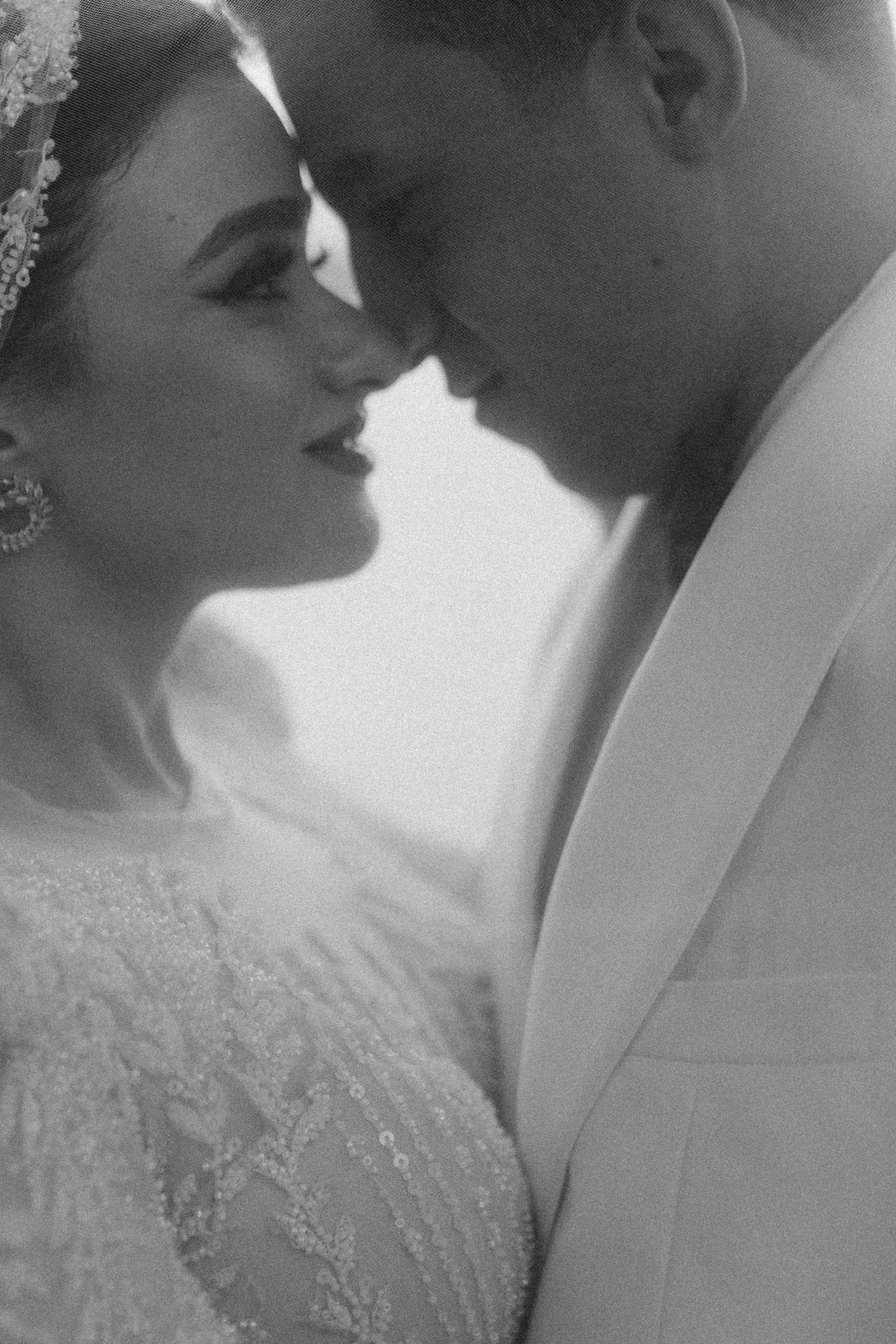 A bridal couple embracing | Source: Pexels