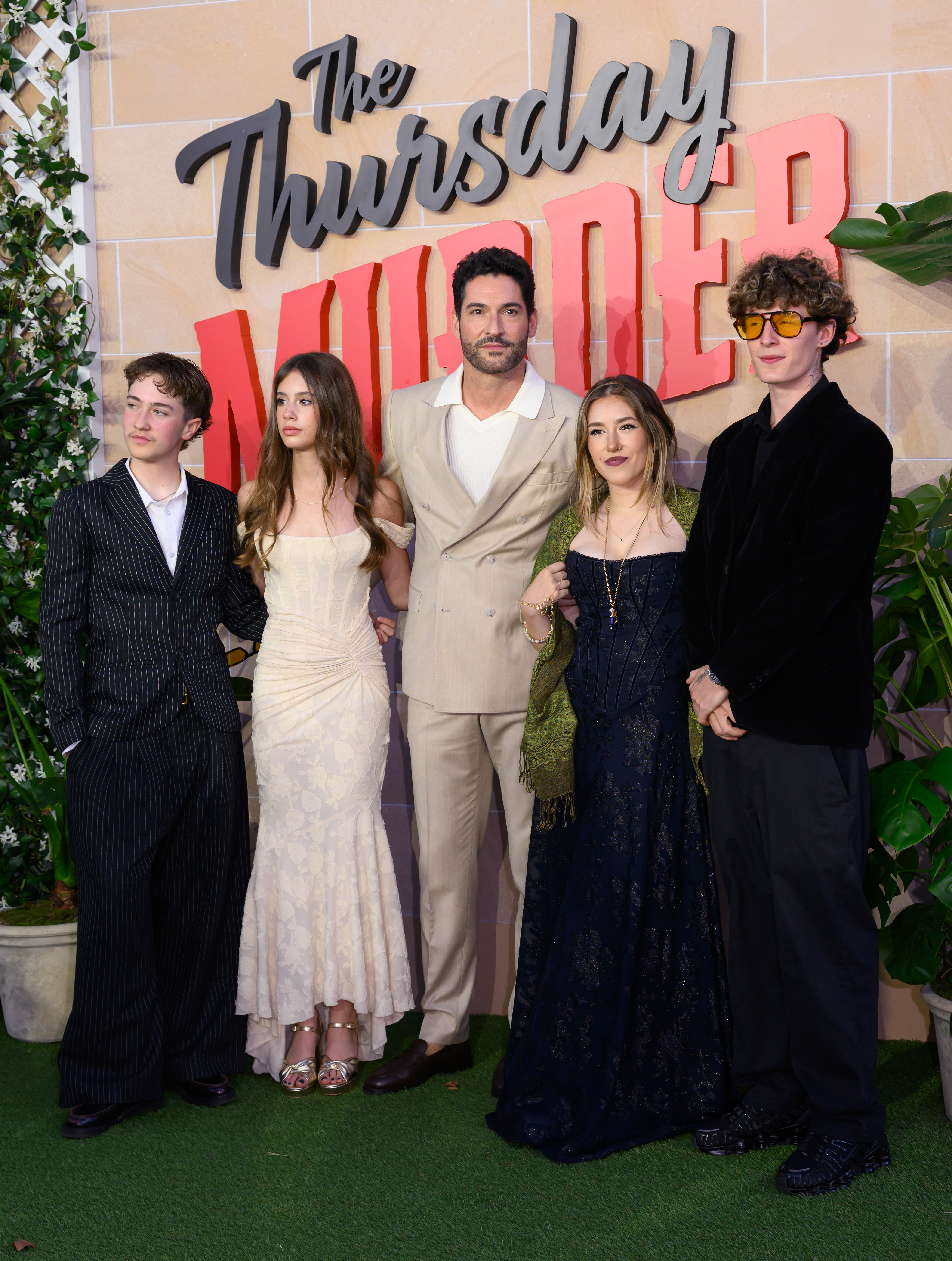 (L-R) Flo Ellis, Marnie Ellis, Tom Ellis, Nora Ellis, and guest attend "The Thursday Murder Club" UK Premiere at Leicester Square Gardens on August 21, 2025, in London, England. | Source: Getty Images