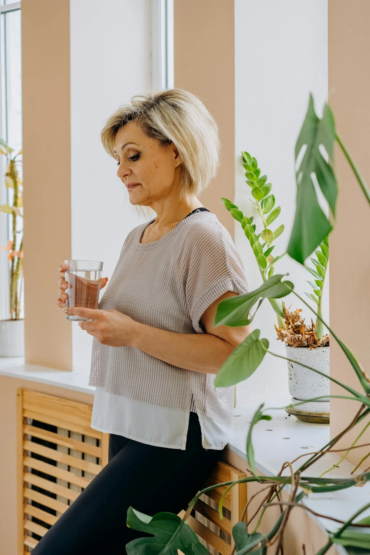 A dissatisfied woman with a cup of tea | Source: Pexels