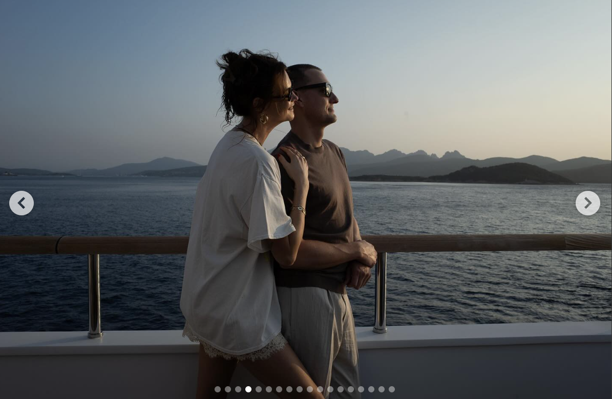 Behati Prinsloo and Adam Levine share an embrace while on a boat, posted on June 19, 2025 | Source: Instagram/behatiprinsloo