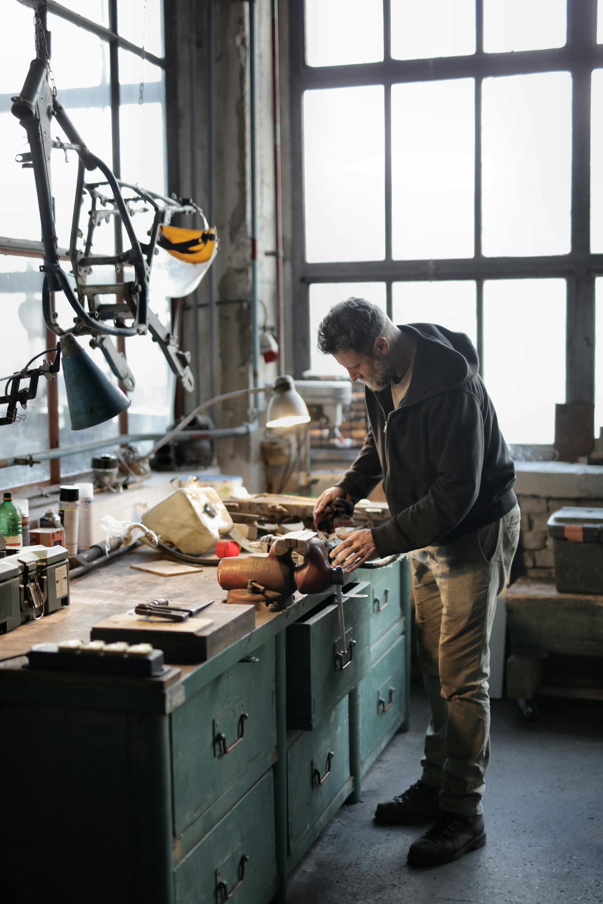 A man working in a garage | Source: Pexels