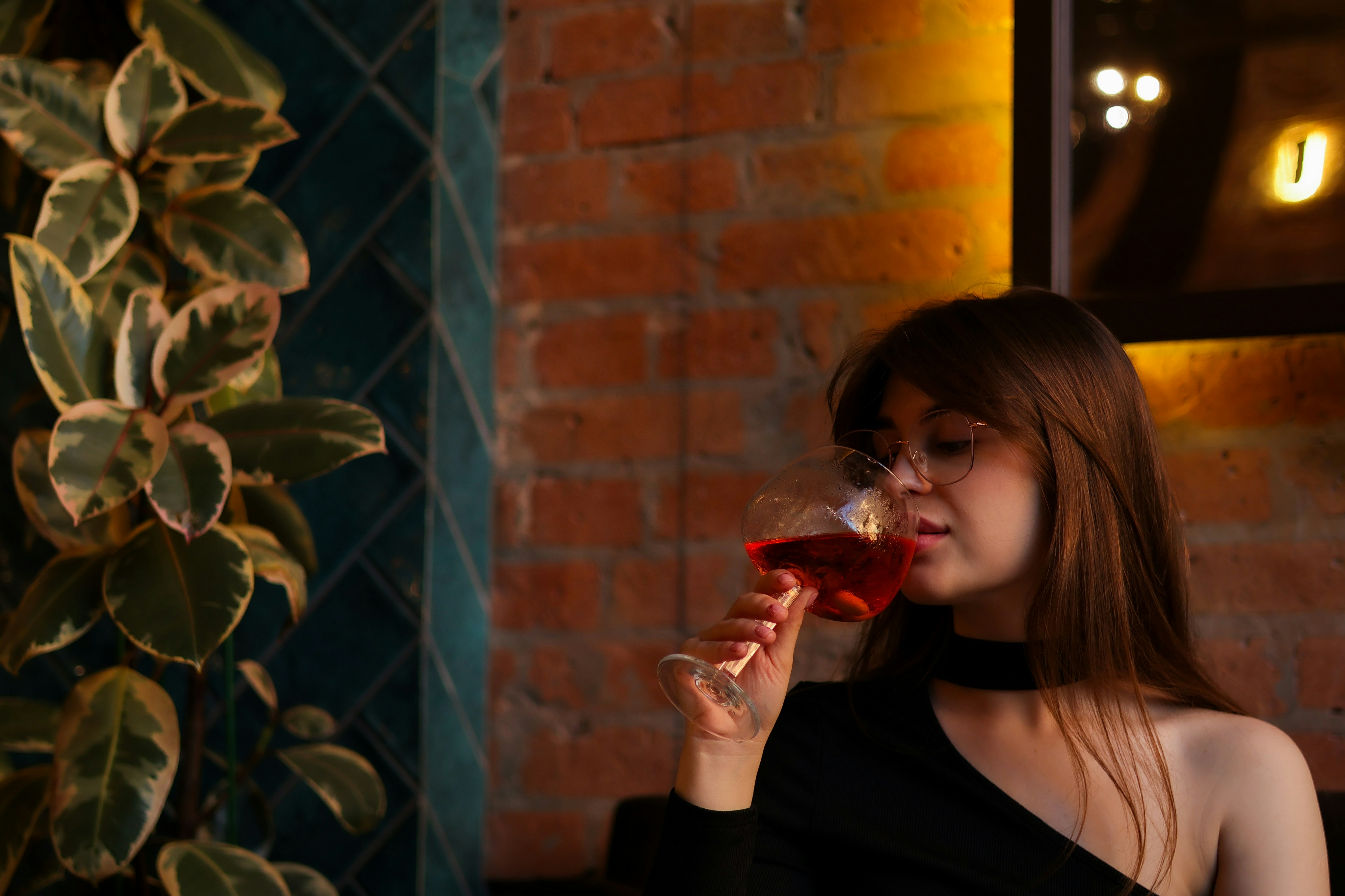 A woman sitting at a restaurant table | Source: Unsplash