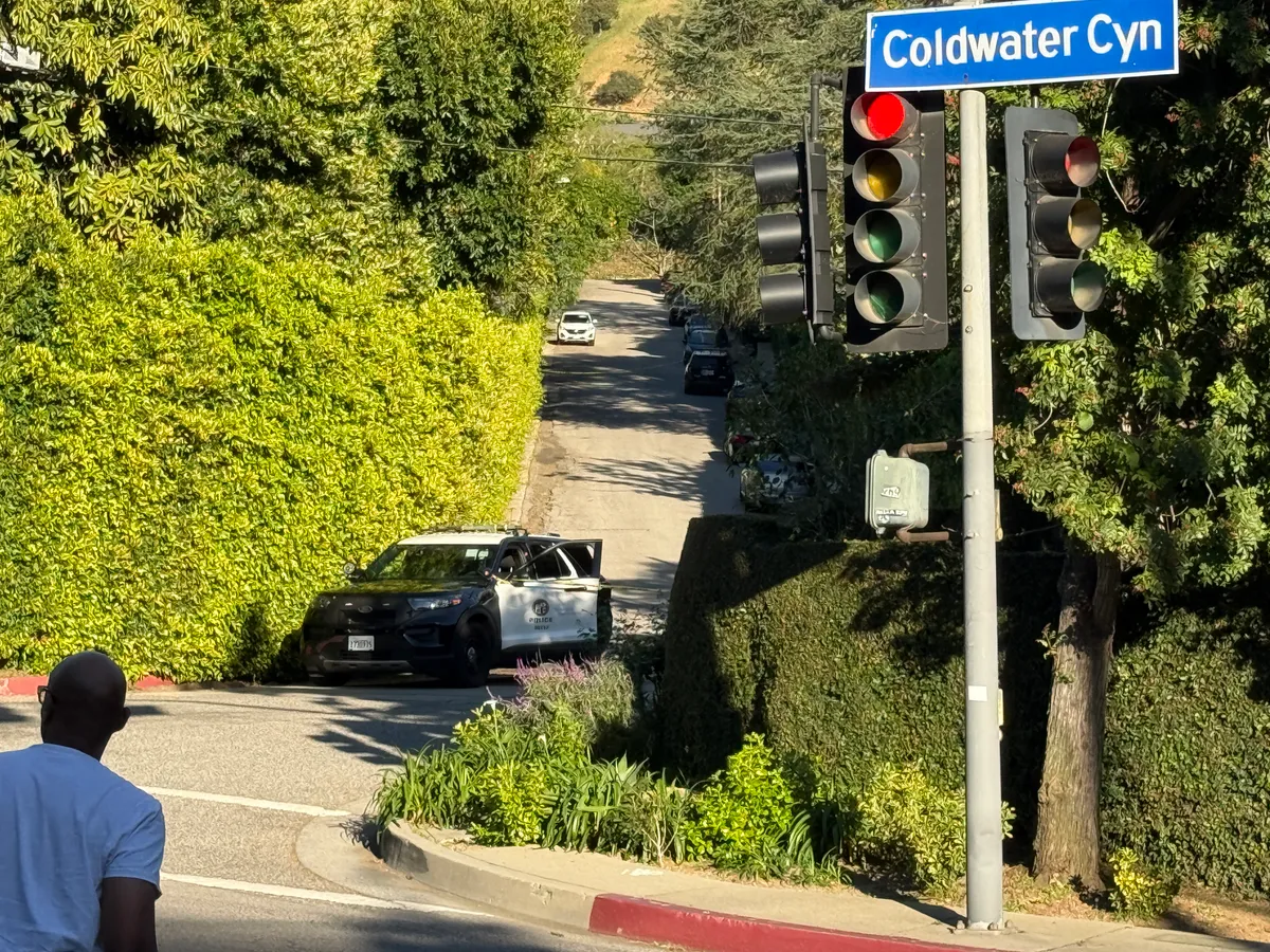 Police are seen outside Rihanna's home after a report of gunshots on March 08, 2026 in Beverly Hills, California. | Source: Getty Images