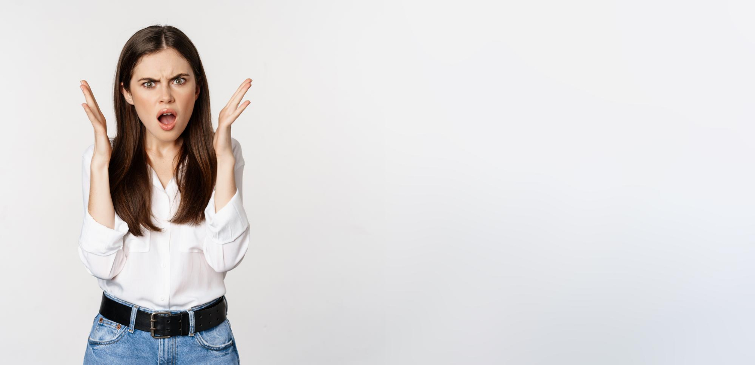 A shocked and angry woman | Source: Freepik