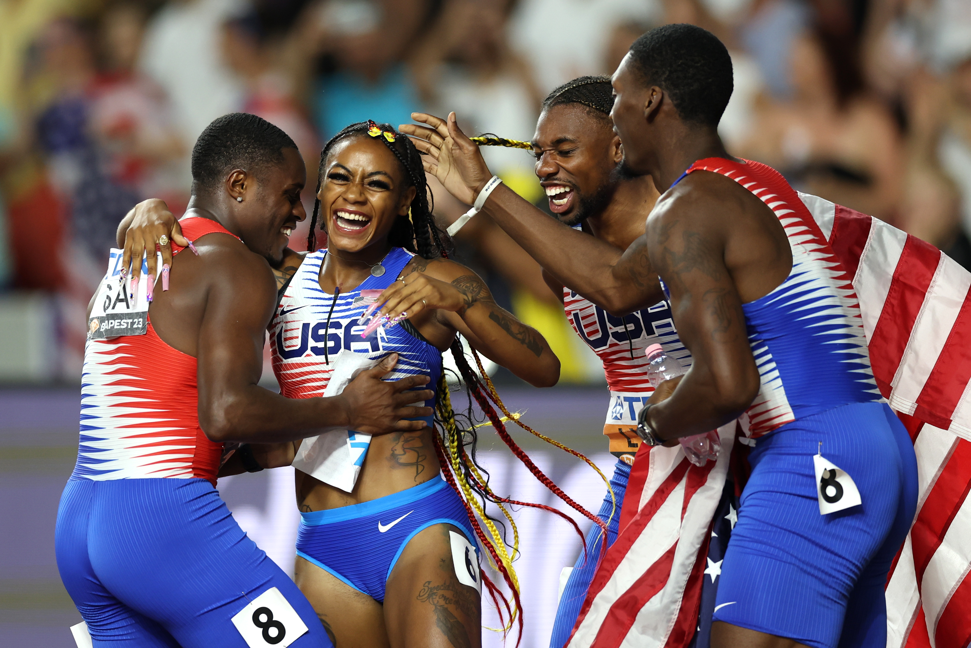 Sha'Carri Richardson of Team United States celebrates with Christian Coleman, Noah Lyles, and Fred Kerley after winning the Women's 4x100m Relay Final during Day Eight of the World Athletics Championships Budapest 2023 at National Athletics Centre on August 26, 2023, in Budapest, Hungary. | Source: Getty Images