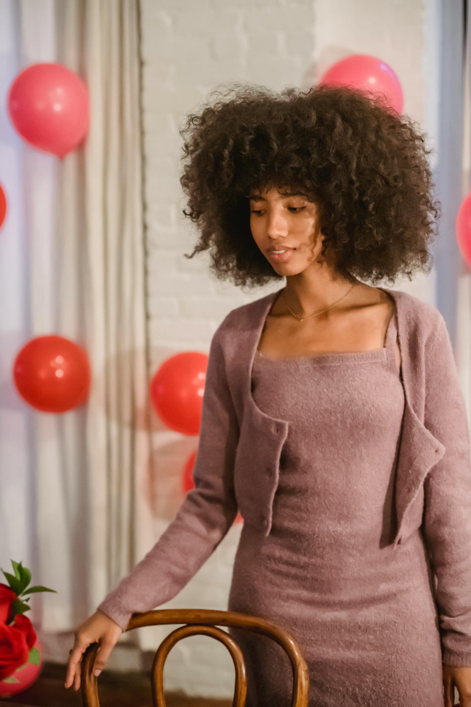 A woman next to a table at a house party | Source: Pexels