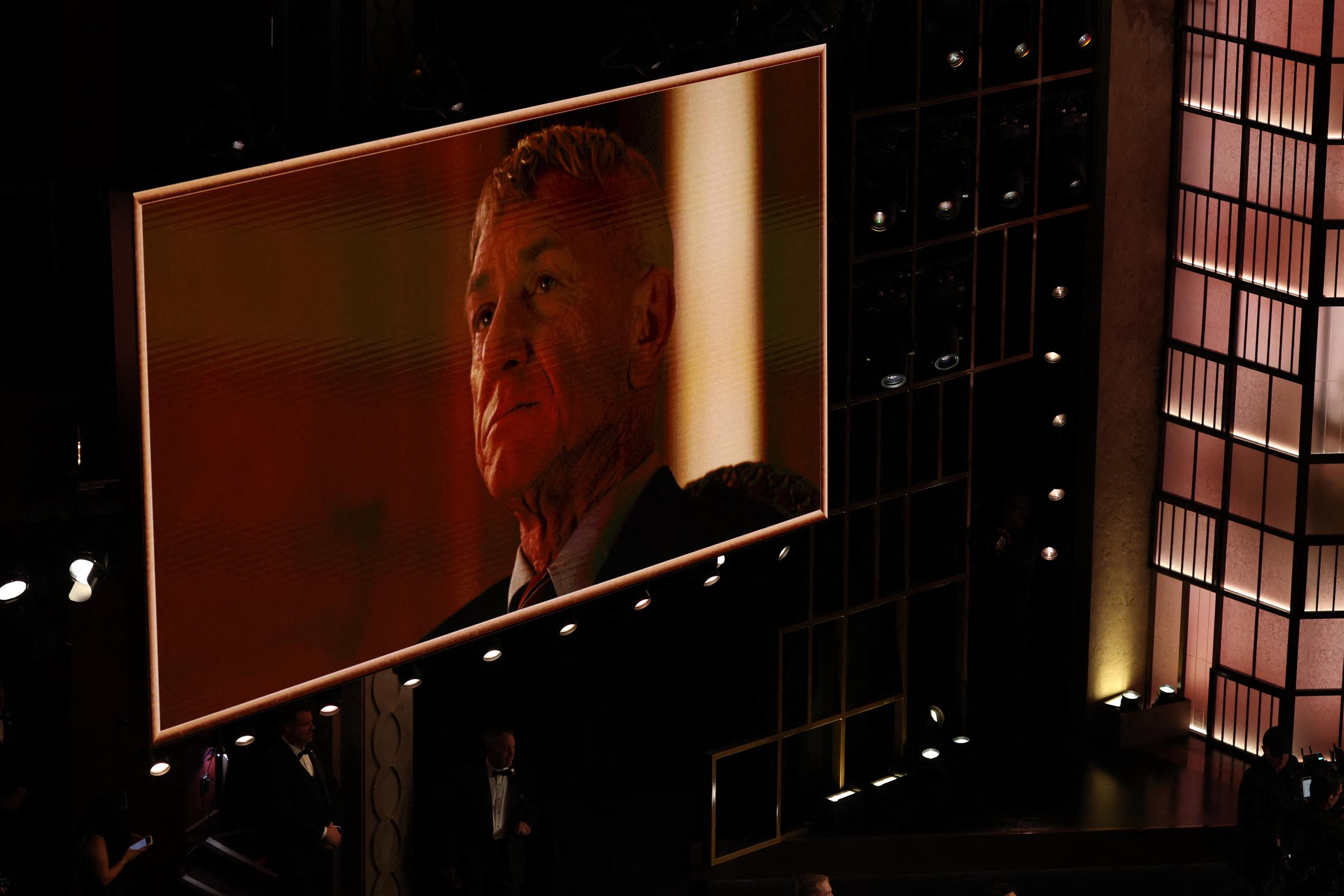 A photo of US actor Sean Penn is shown onstage after he won the Oscar for Best Actor in a Supporting Role for "One Battle After Another" during the 98th Annual Academy Awards at the Dolby Theatre in Hollywood, California on March 15, 2026. | Source: Getty Images
