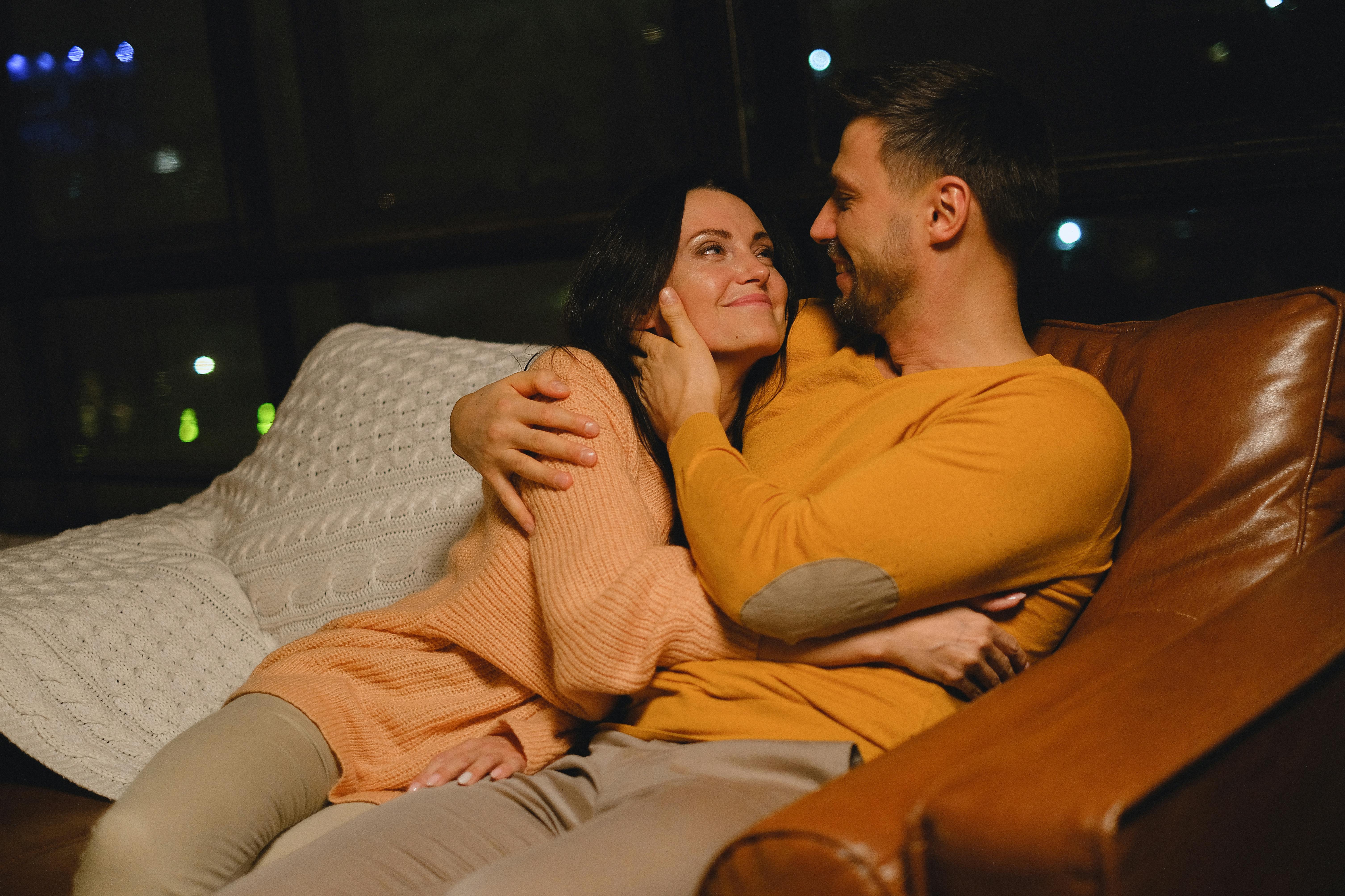 Couple sitting on a couch | Source:  Pexels