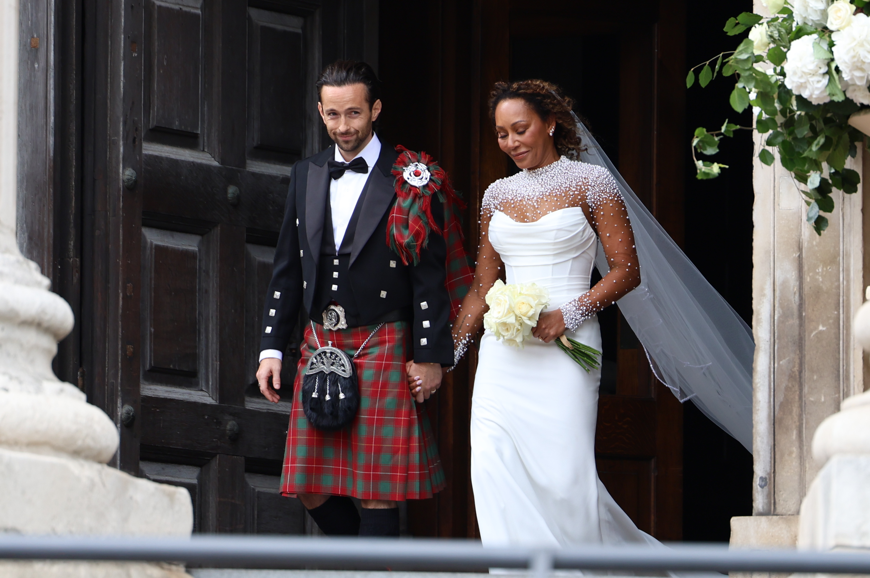 Rory McPhee and Mel B depart following their wedding in the OBE (Order of the British Empire) Chapel at St Paul's Cathedral on July 5, 2025, in London, England. | Source: Getty Images
