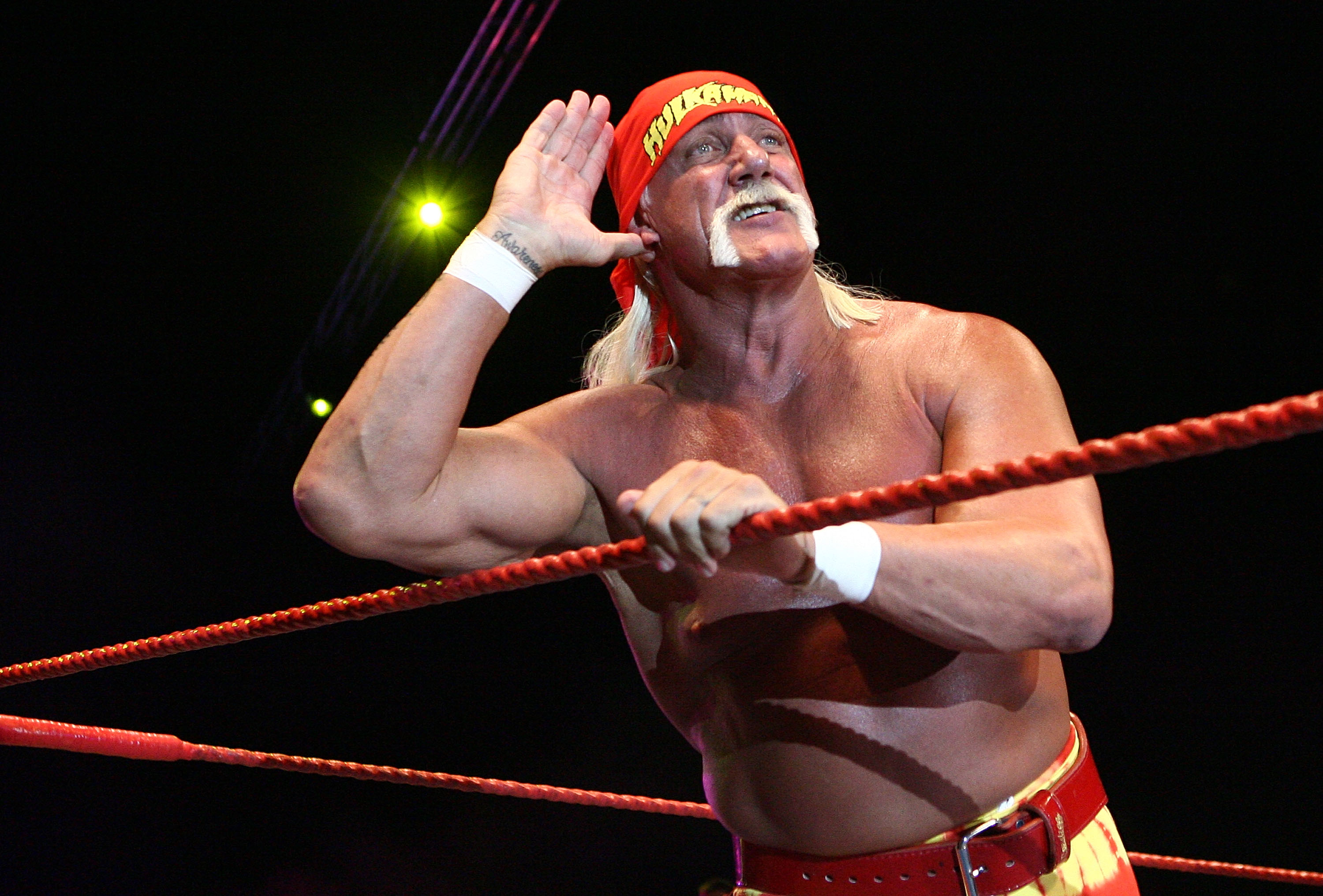 Hulk Hogan gestures to the audience during his Hulkamania Tour at the Burswood Dome on November 24, 2009, in Perth, Australia. | Source: Getty Images