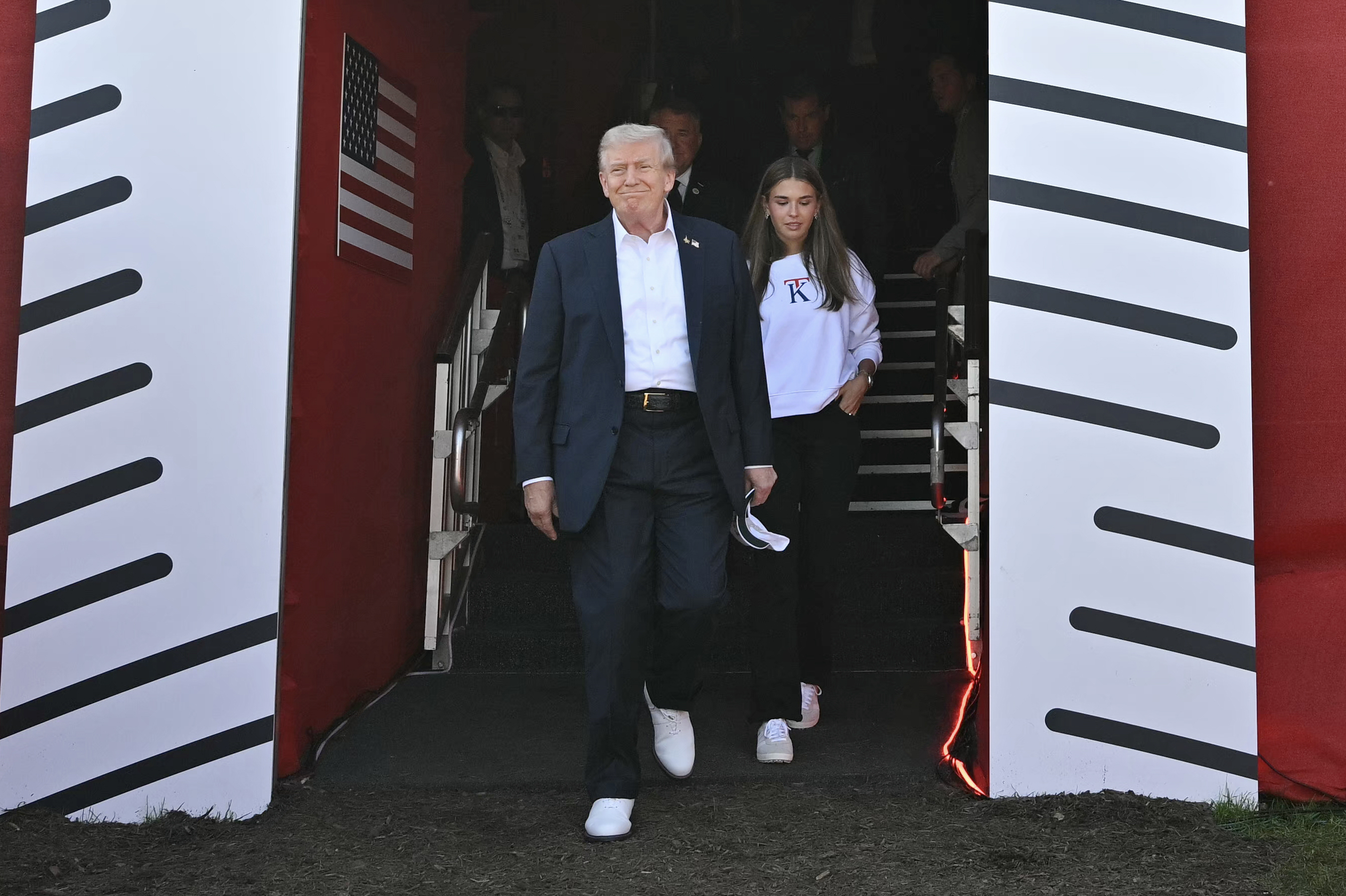 U.S. President Donald Trump, along with his granddaughter Kai Madison Trump, attends the 2025 Ryder Cup at Black Course at Bethpage State Park Golf Course on September 26, 2025, in Farmingdale, New York. | Source: Getty Images