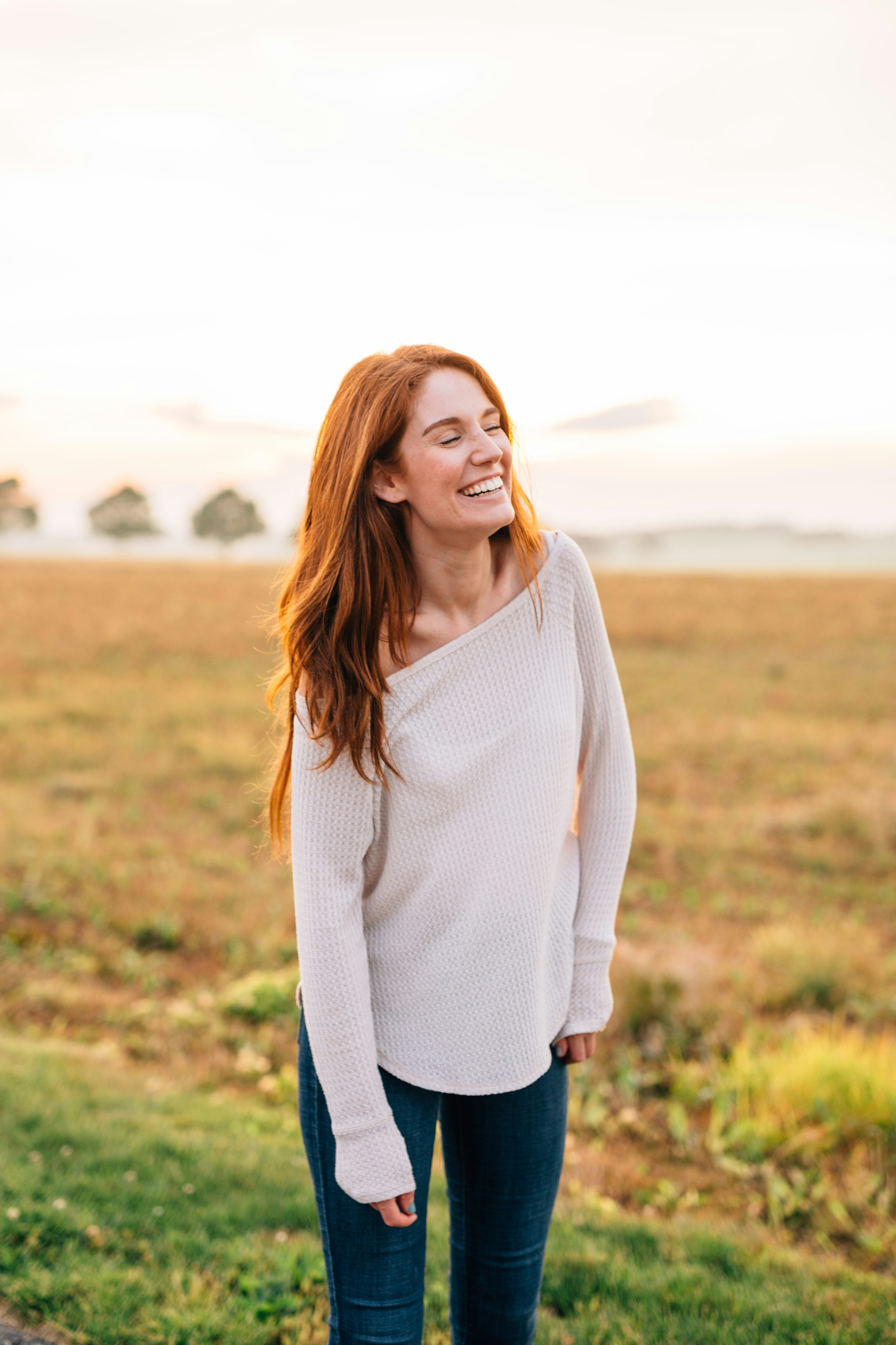 A smiling woman standing outside | Source: Unsplash