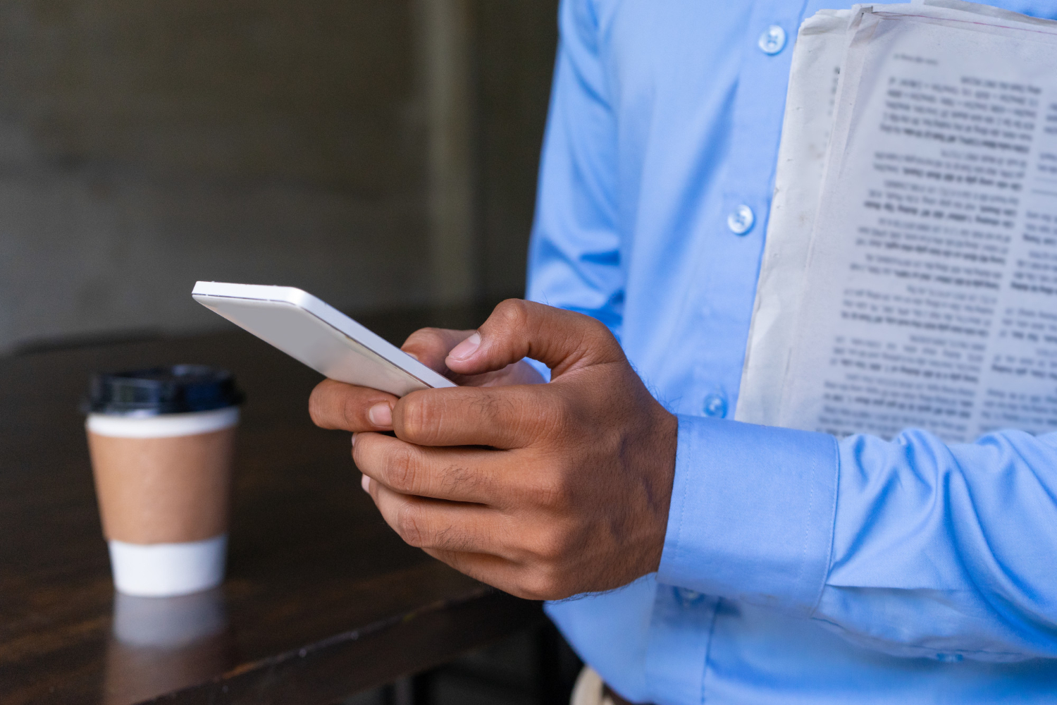 A man holding a phone and paper | Source: Freepik