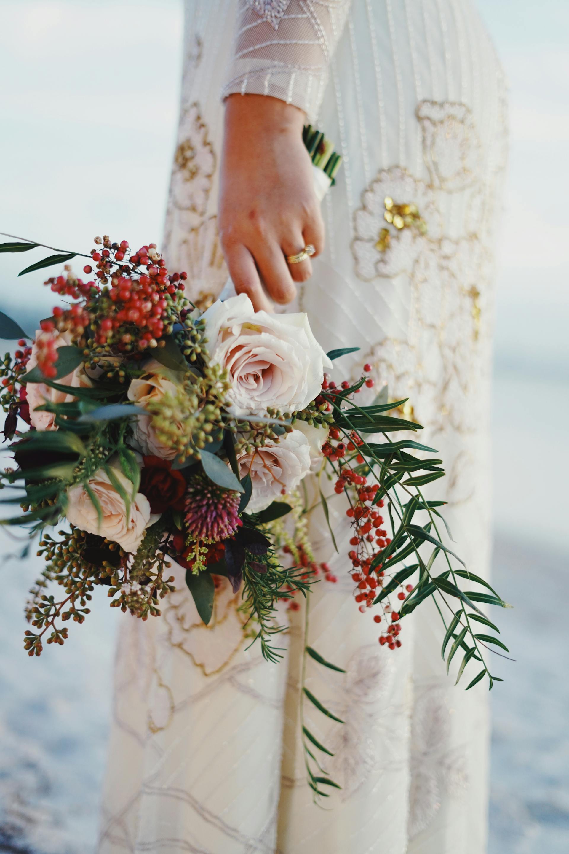 A bride holding her bouquet in one hand | Source: Pexels