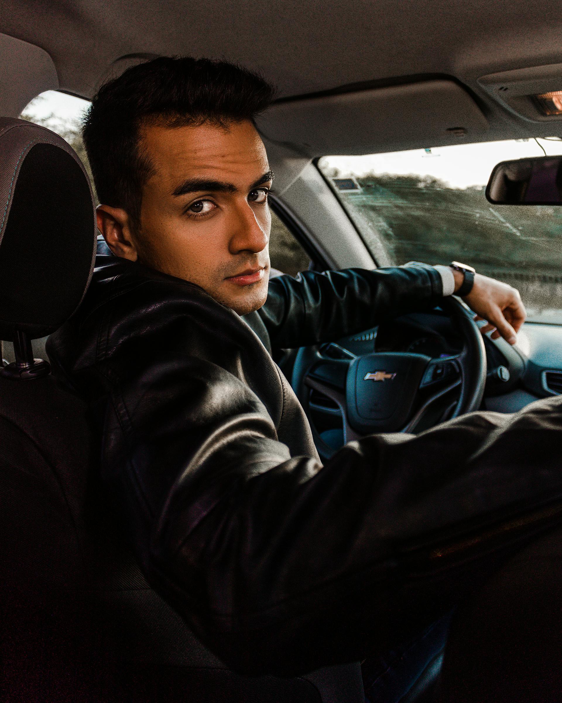 A man looking back in his car | Source: Pexels