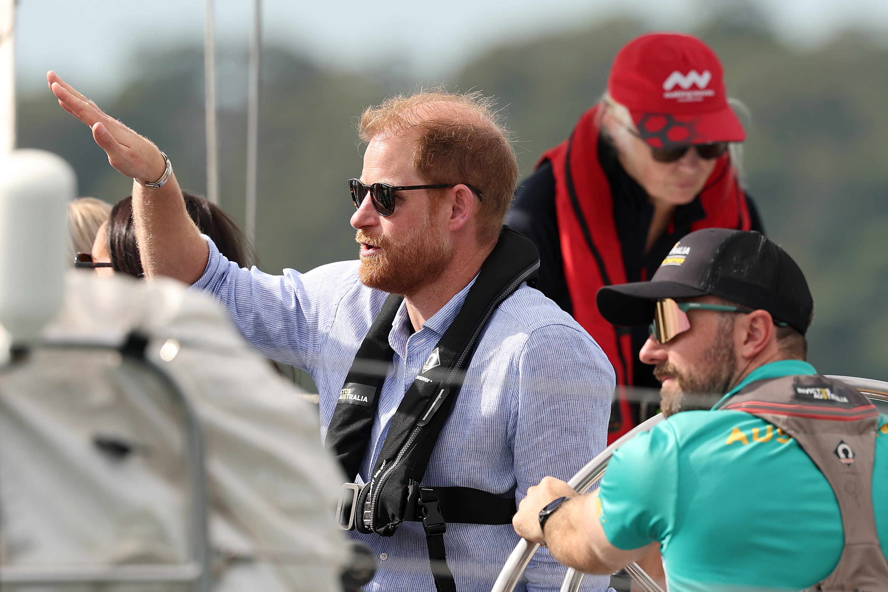 Prince Harry, Duke of Sussex speaks to members of Invictus Australia while on a sailing boat on Sydney Harbour on April 17, 2026 in Sydney, Australia. | Source: Getty Images
