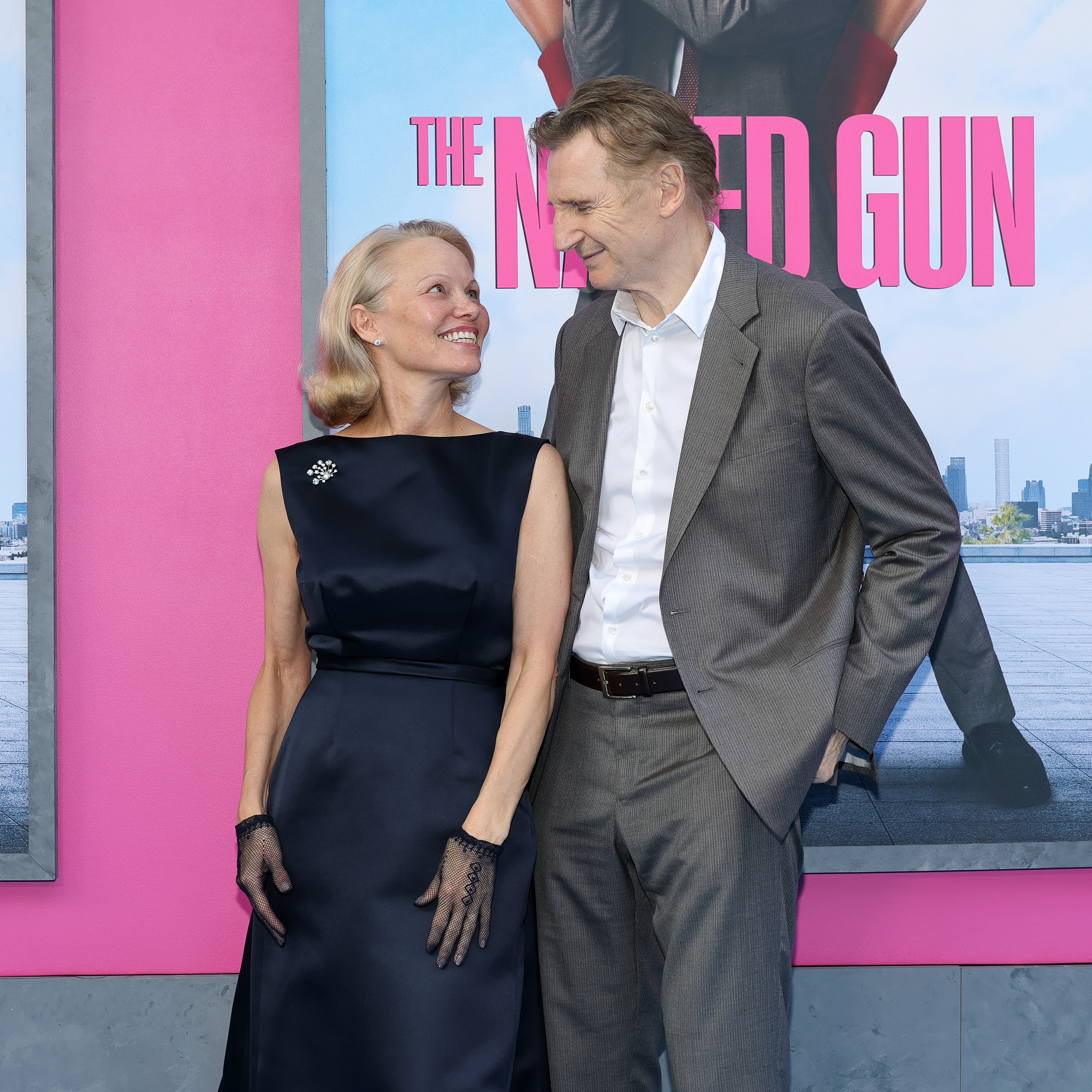 Pamela Anderson and Liam Neeson attend the New York premiere of "The Naked Gun," 2025 | Source: Getty Images