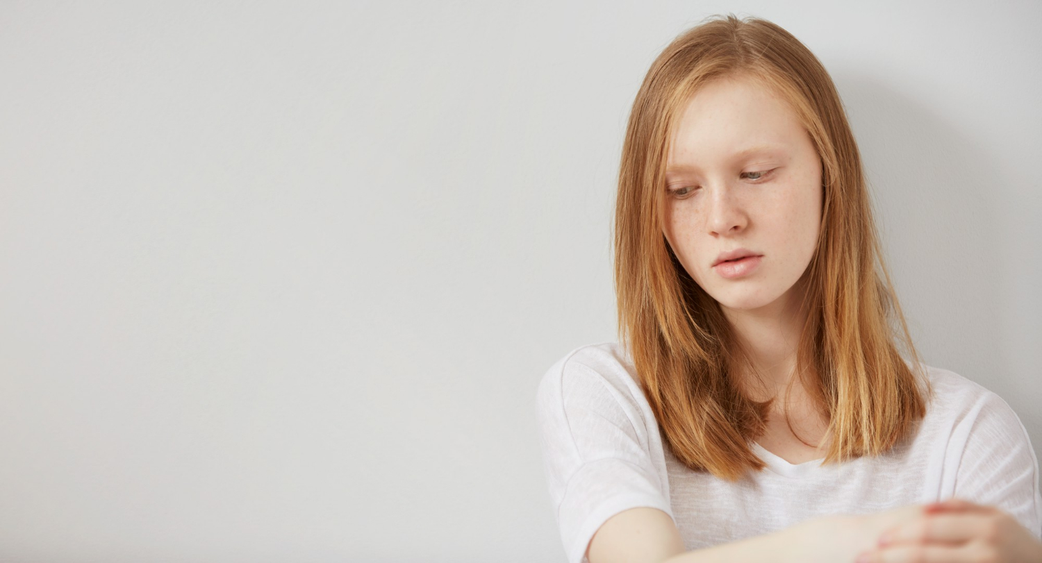 A sad teenage girl | Source: Freepik