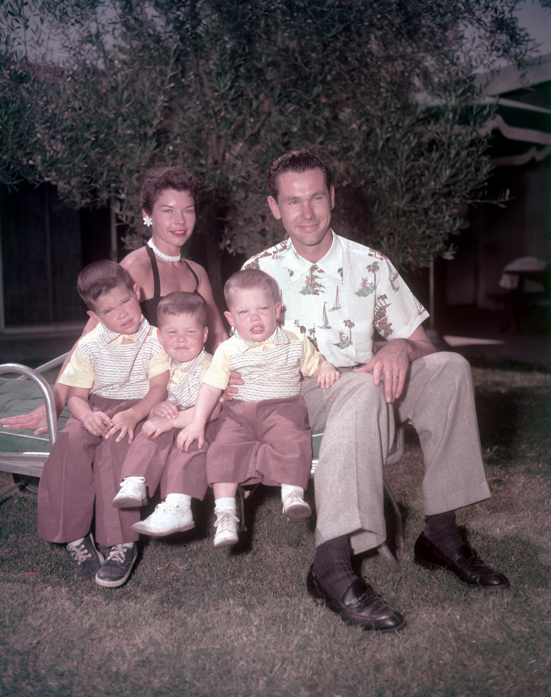 Johnny Carson and his ex-wife, Jody Wolcott, pose with their three sons, Christopher (Kit), Richard, and Cory, in the back yard of their old home in Encino, California, circa 1955. | Source: Getty Images