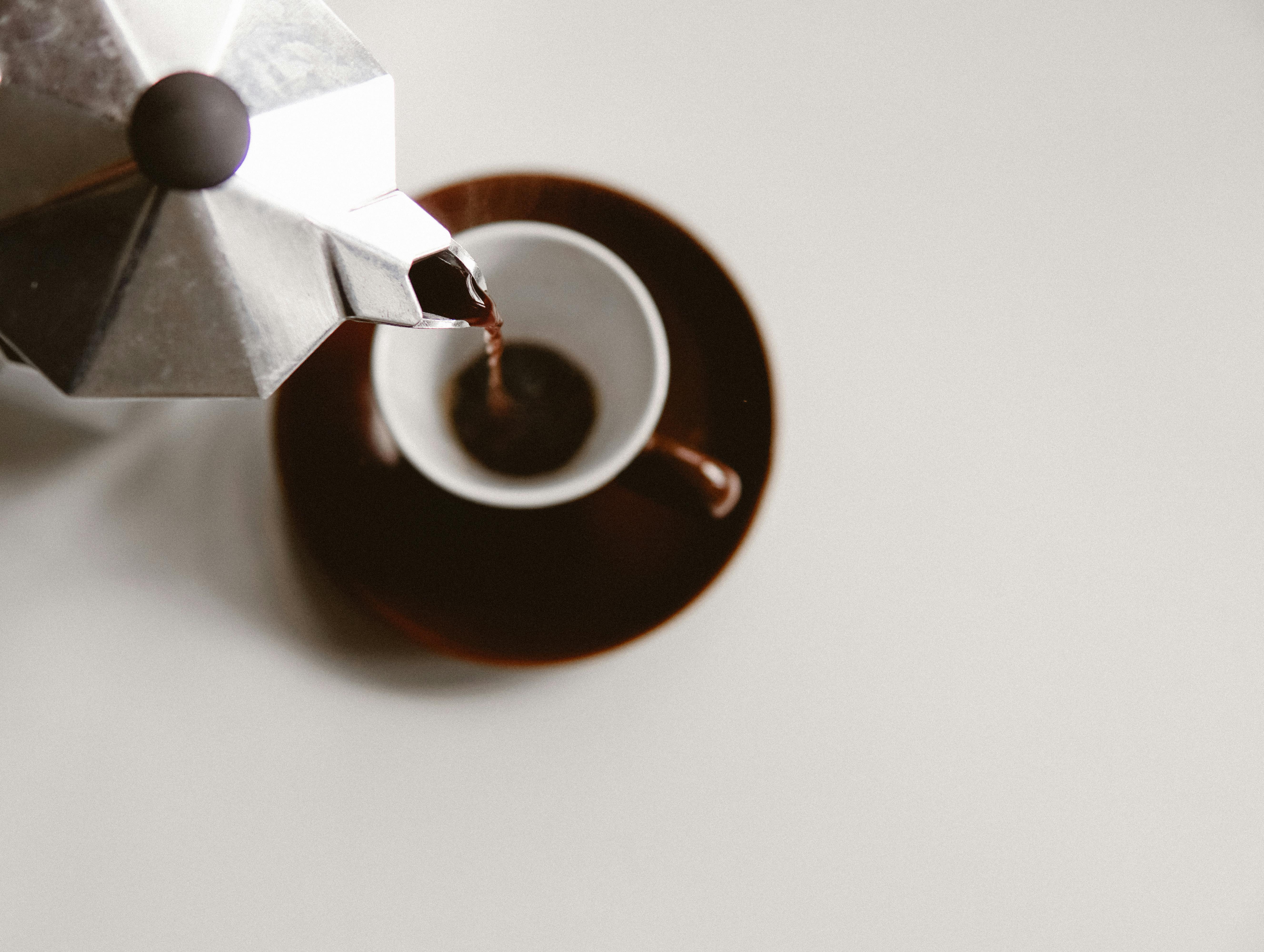 Coffee being poured into a cup | Source: Pexels