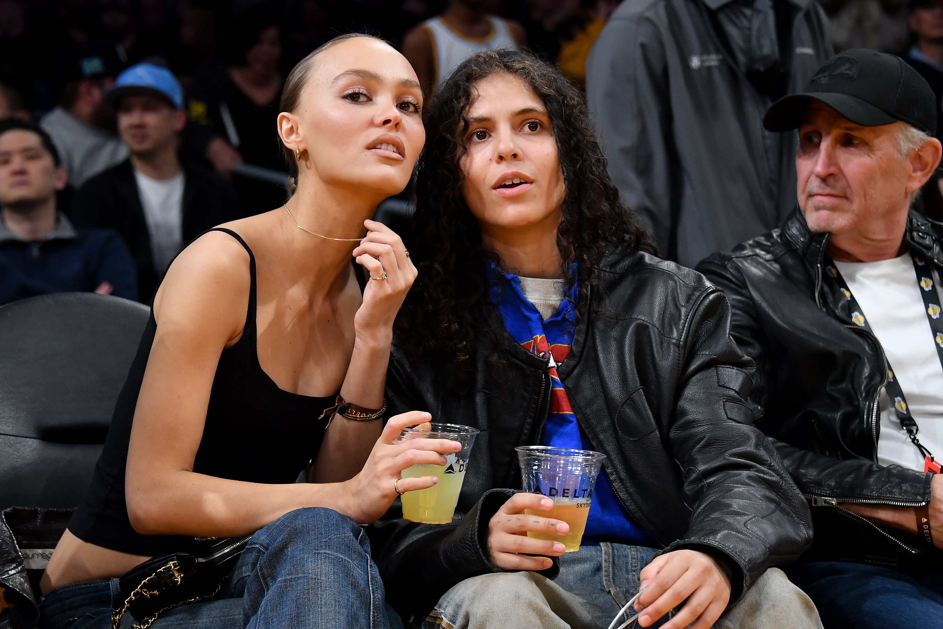Lily-Rose Depp and 070 Shake attend a basketball game between the Los Angeles Lakers and the Minnesota Timberwolves at Crypto.com Arena on March 10, 2024, in Los Angeles, California. | Source: Getty Images
