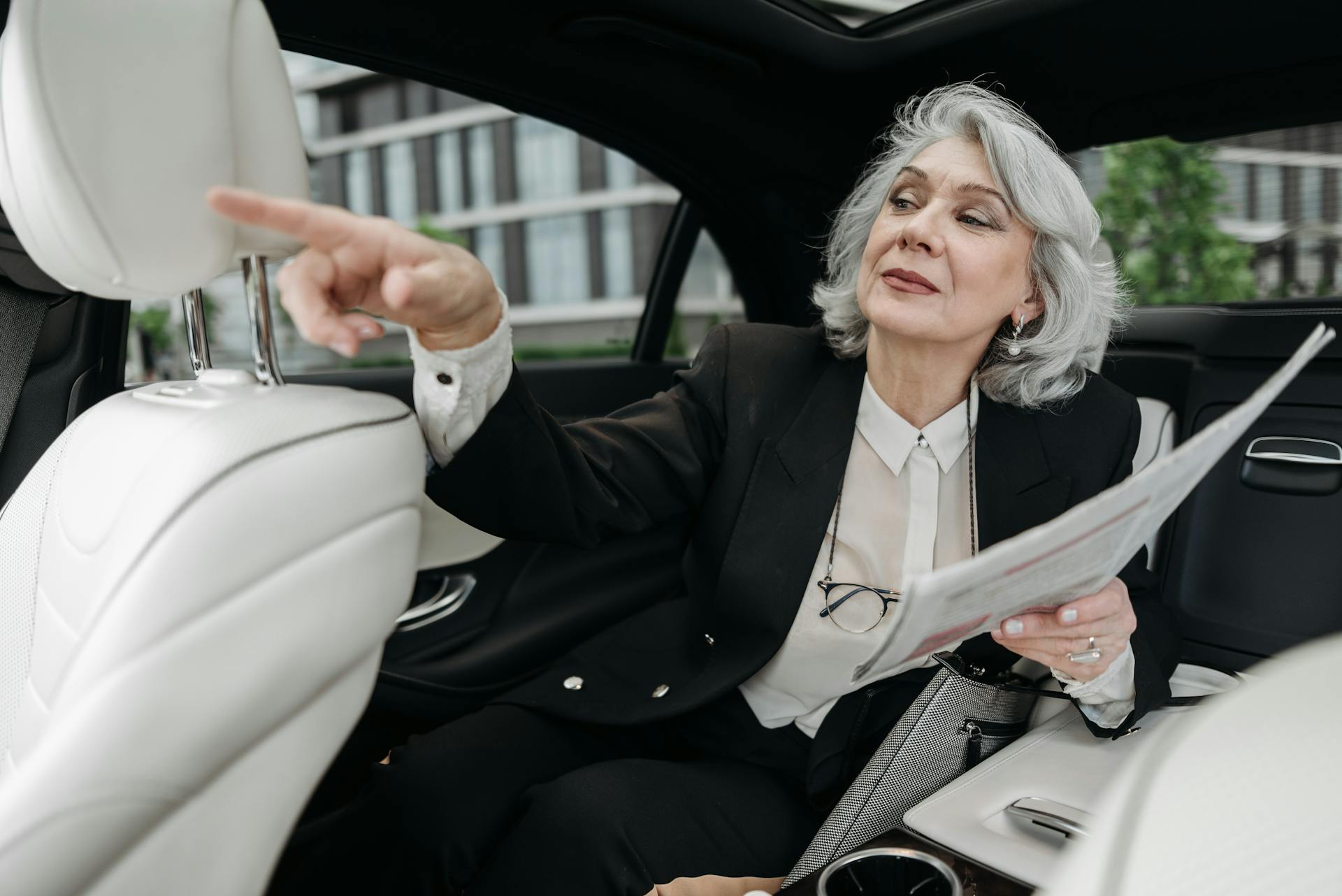 A senior woman sitting in a car | Source: Pexels