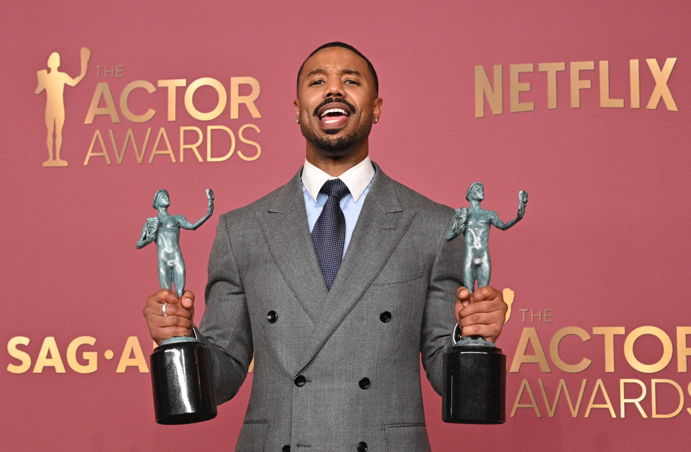 Michael B. Jordan poses with the awards for Outstanding Performance by a Male Actor in a Leading Role and Outstanding Performance by a Cast in a Motion Picture for "Sinners" during the 32nd Annual Actor Awards at the Shrine Auditorium in Los Angeles on March 1, 2026. | Source: Getty Images
