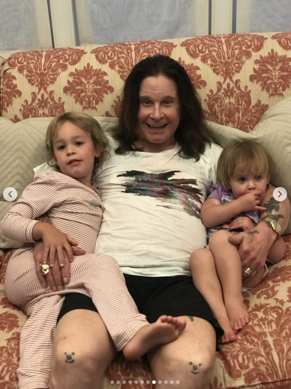 Ozzy Osbourne smiling with two of his grandchildren, posted on July 25, 2025 | Source: Instagram/lisastelly