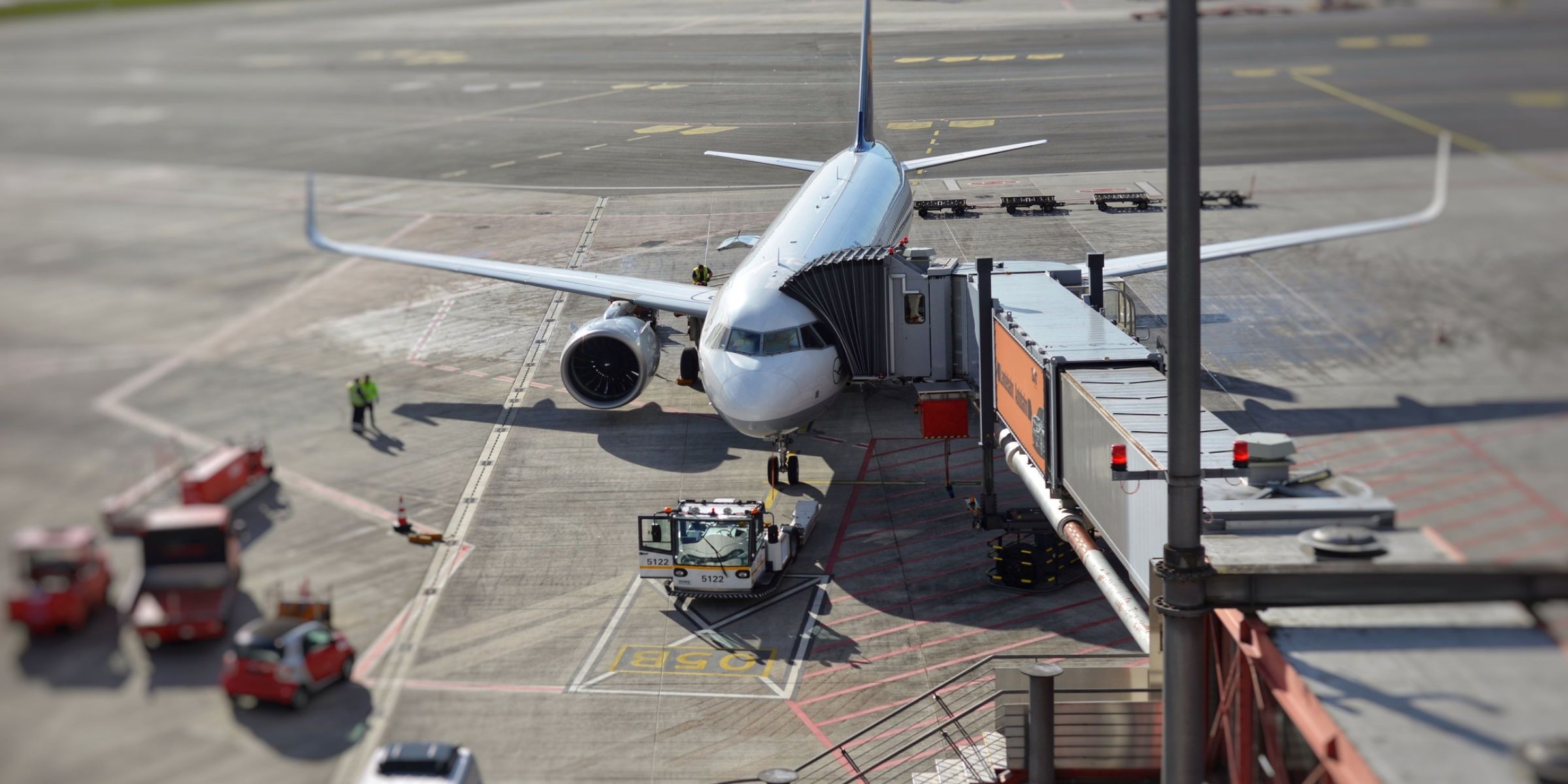 Passenger airplane parked at an airport terminal | Source: Pexels