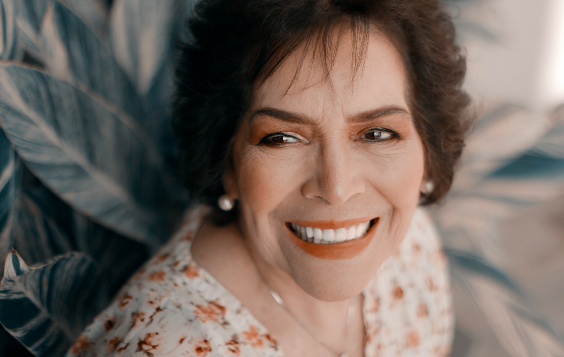 A woman smiling at someone | Source: Unsplash