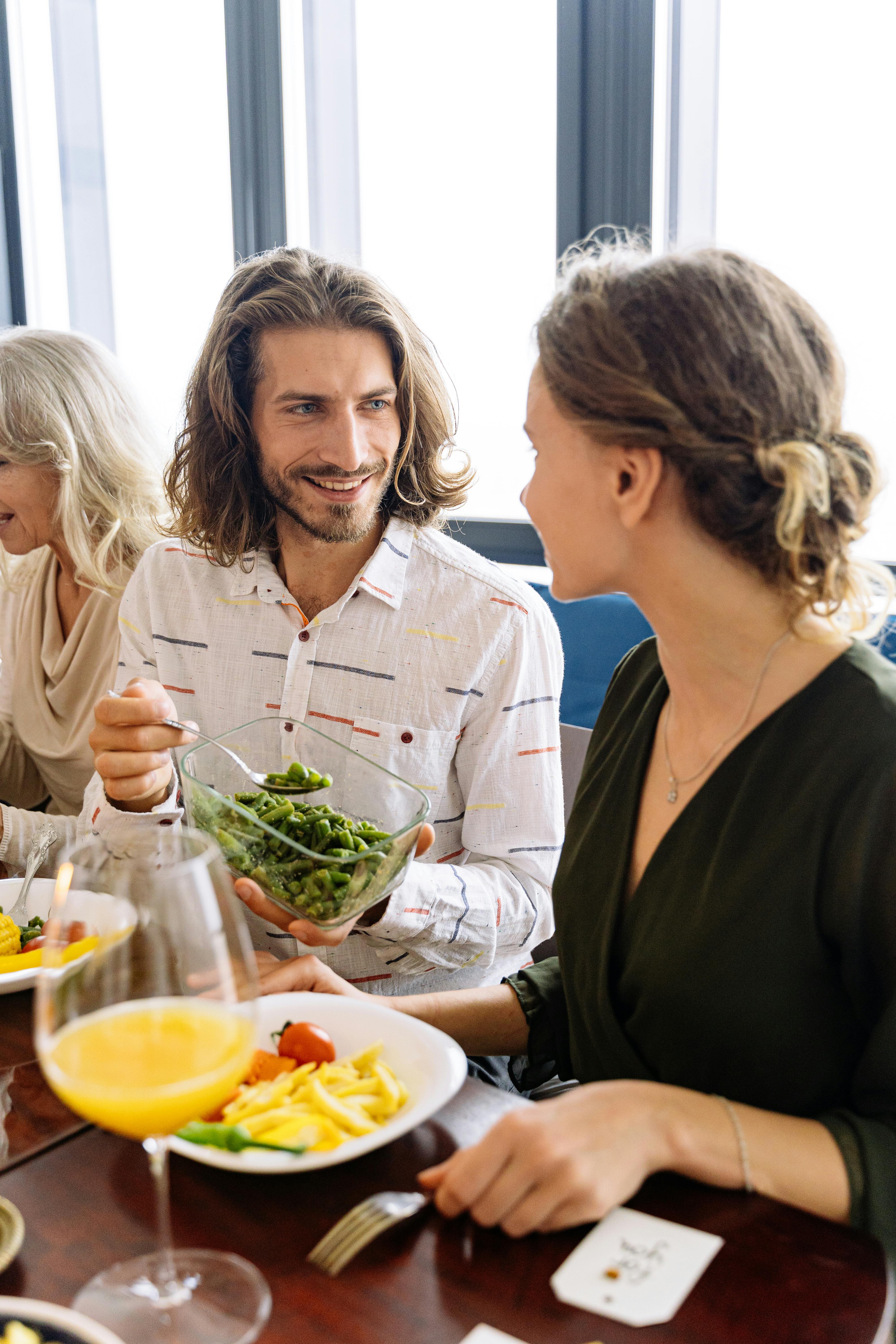 A man serving the woman a meal | Source: Pexels