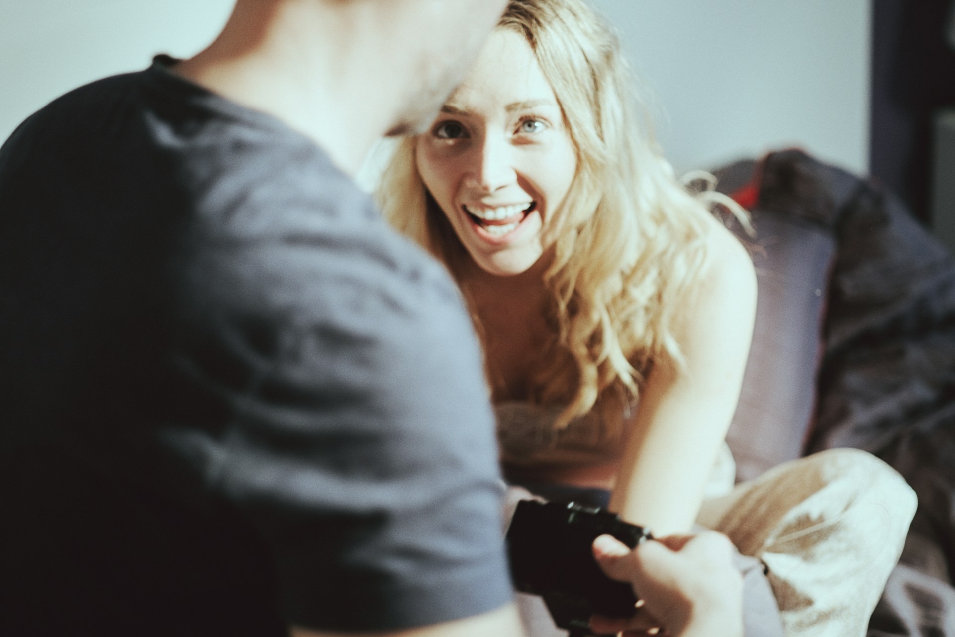 A woman looking at a man and laughing | Source: Unsplash