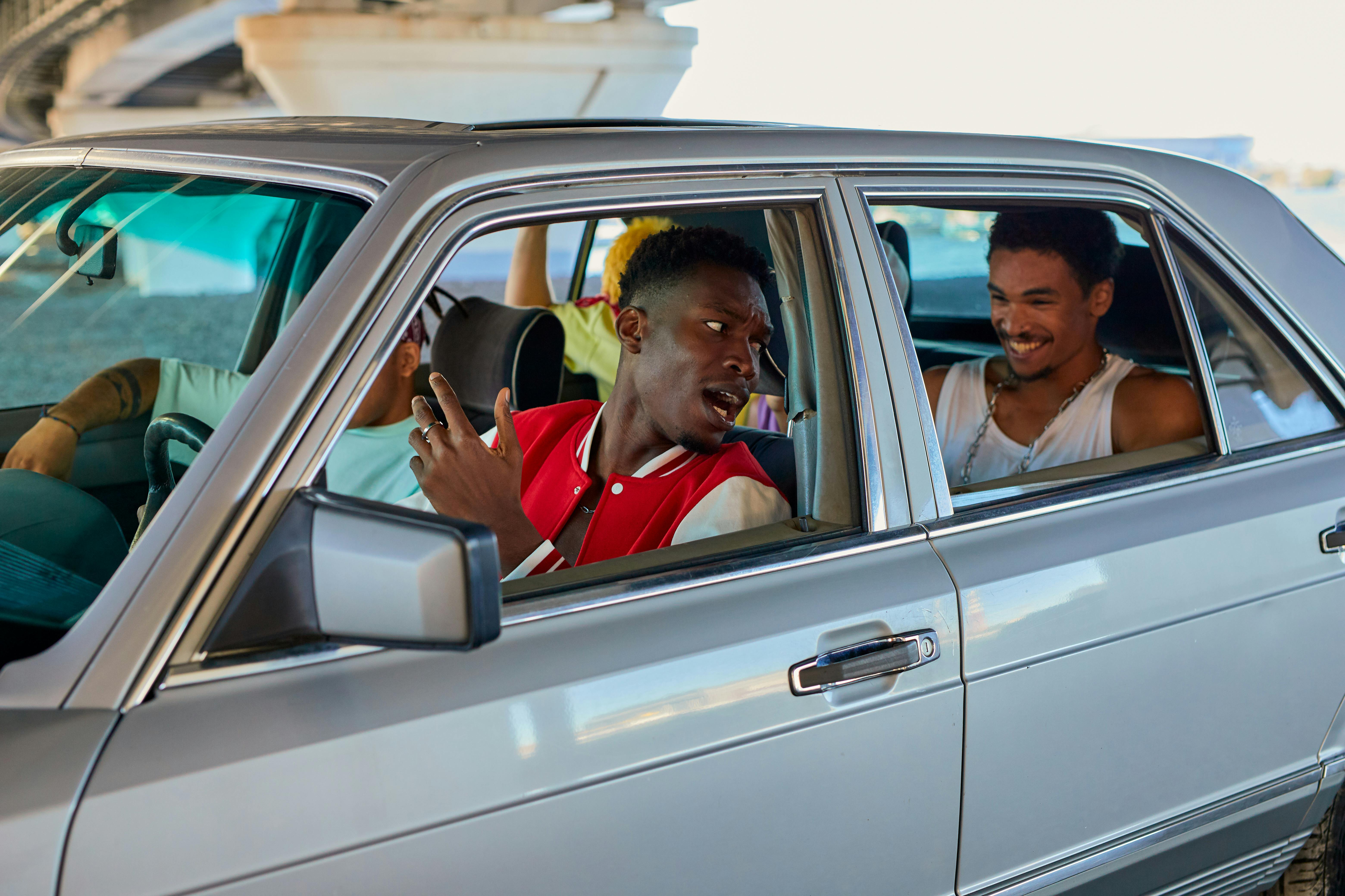 Men sitting in a car | Source: Pexels