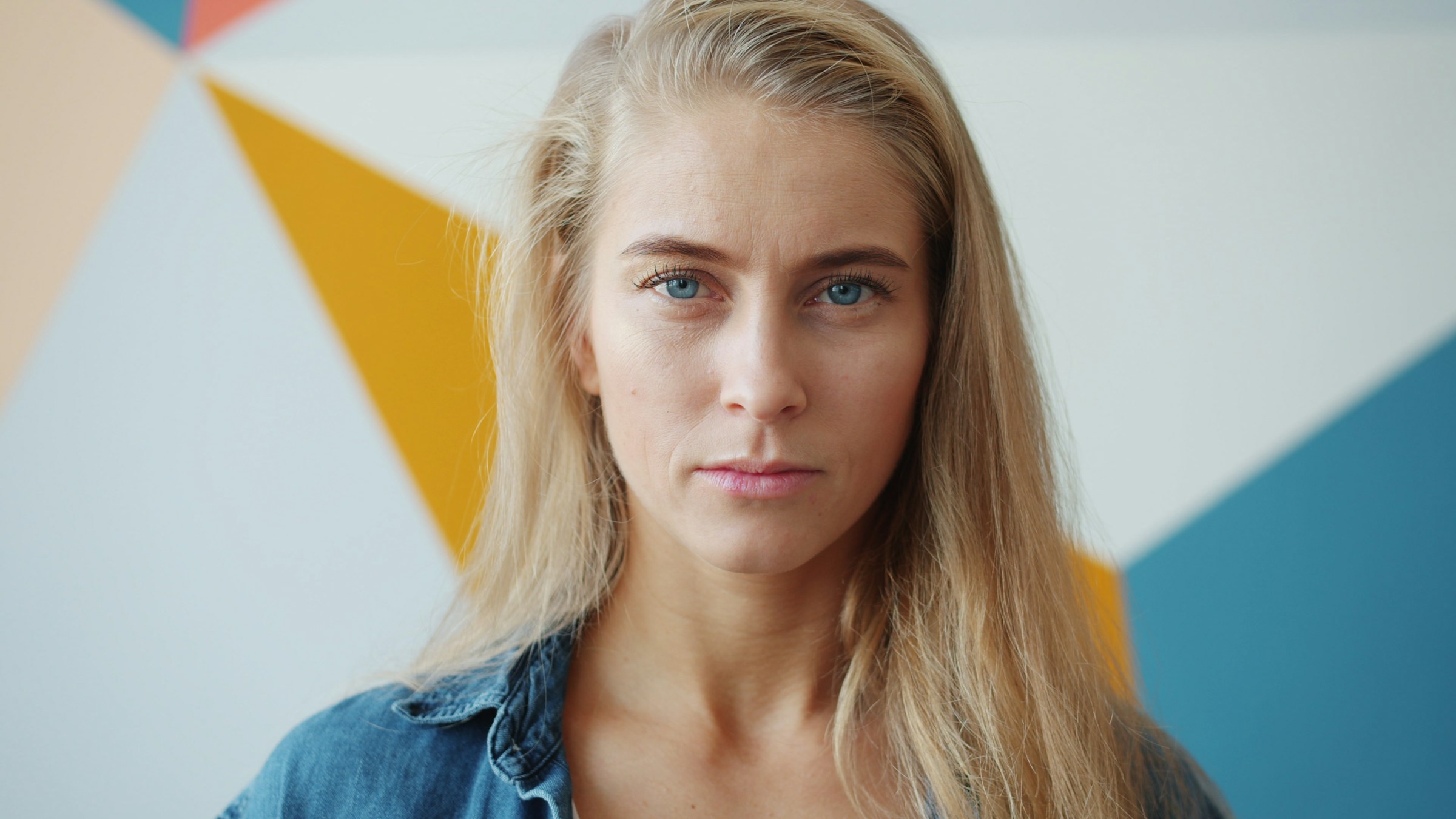 A woman with a serious facial expression | Source: Unsplash