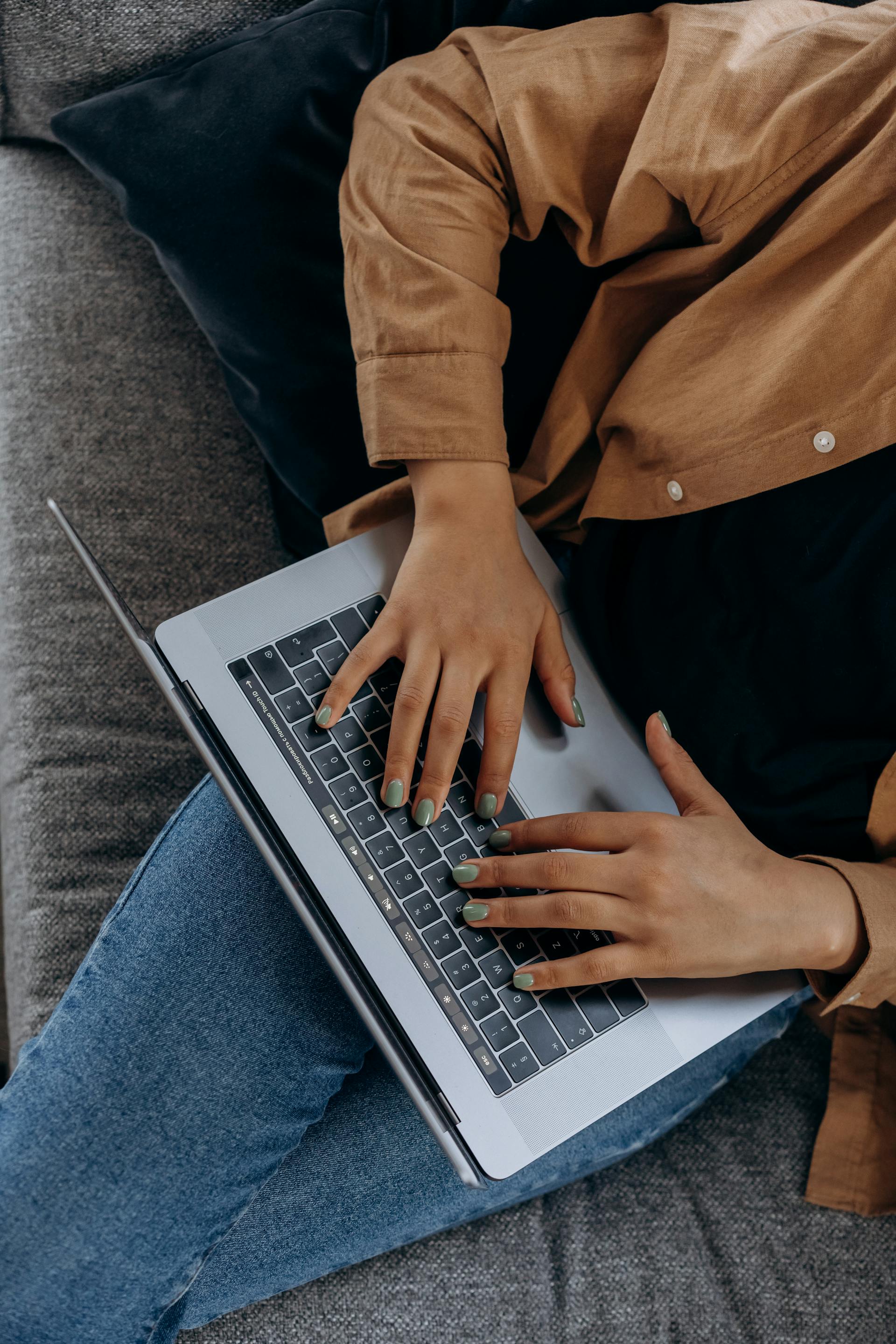 A close-up shot of a woman working on her laptop | Source: Pexels