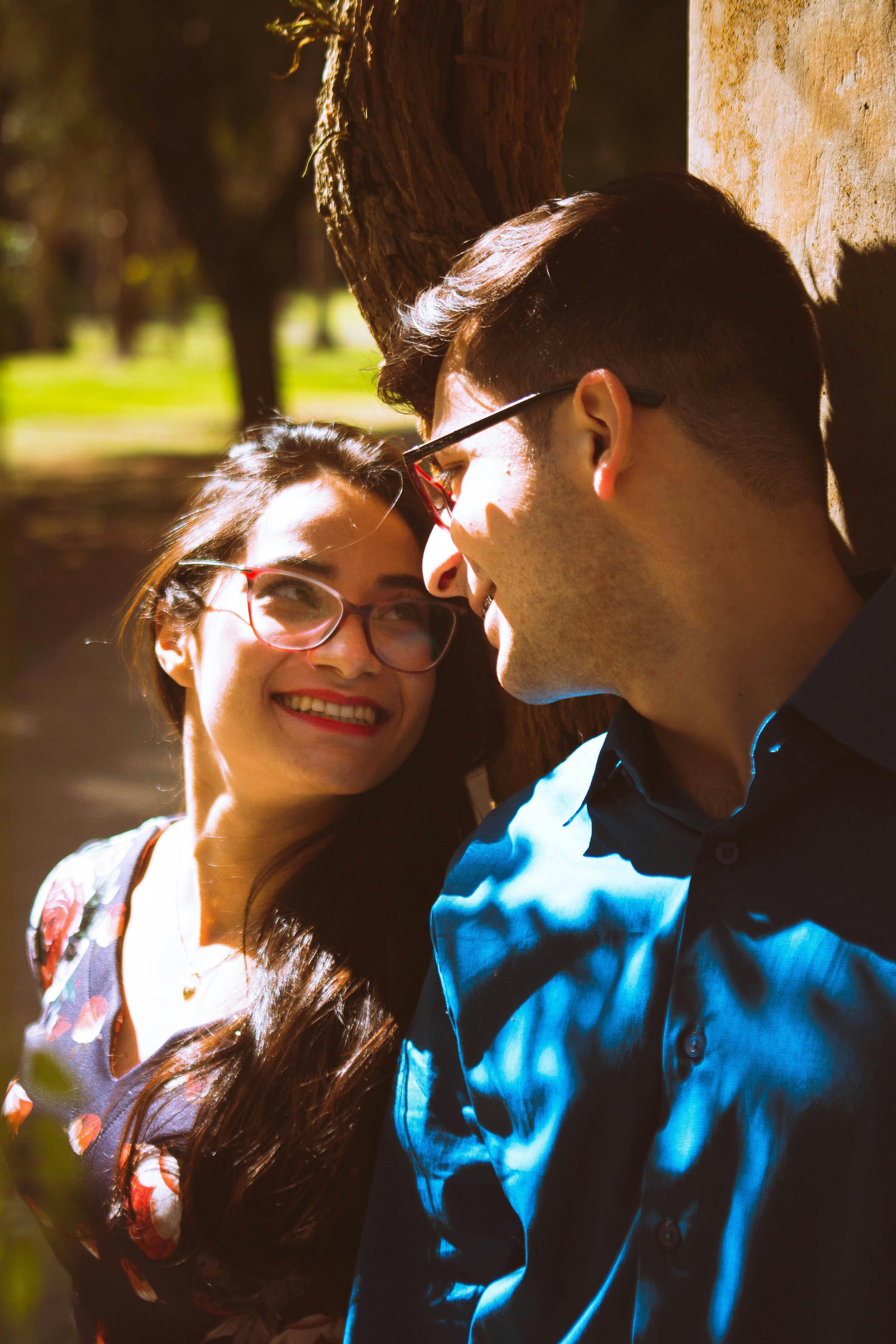 An up-close shot of a couple smiling while looking at each other | Source: Pexels