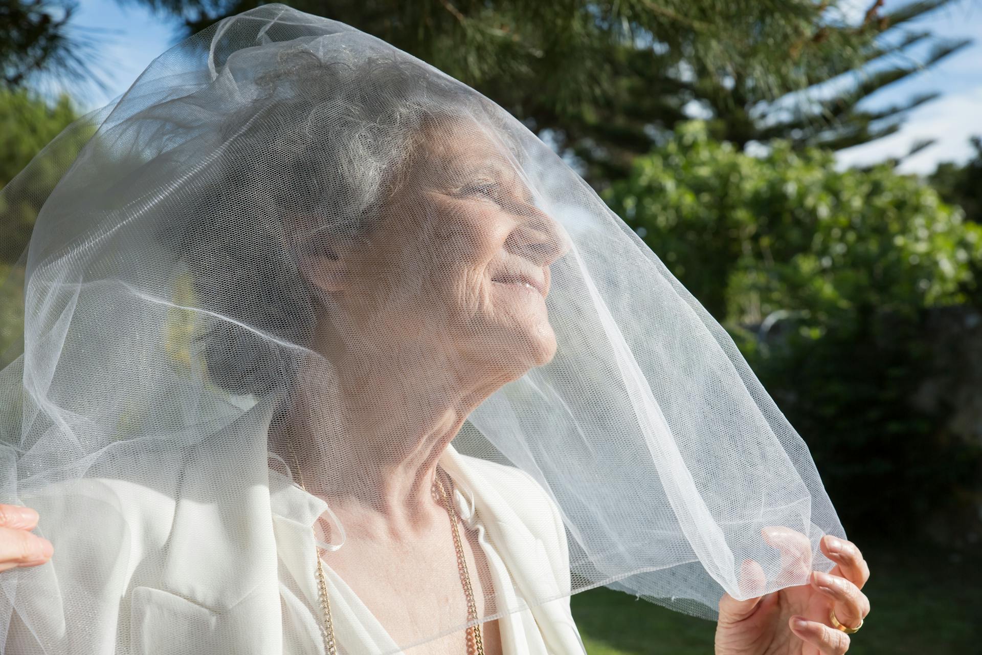 A mature woman wearing a wedding gown | Source: Pexels