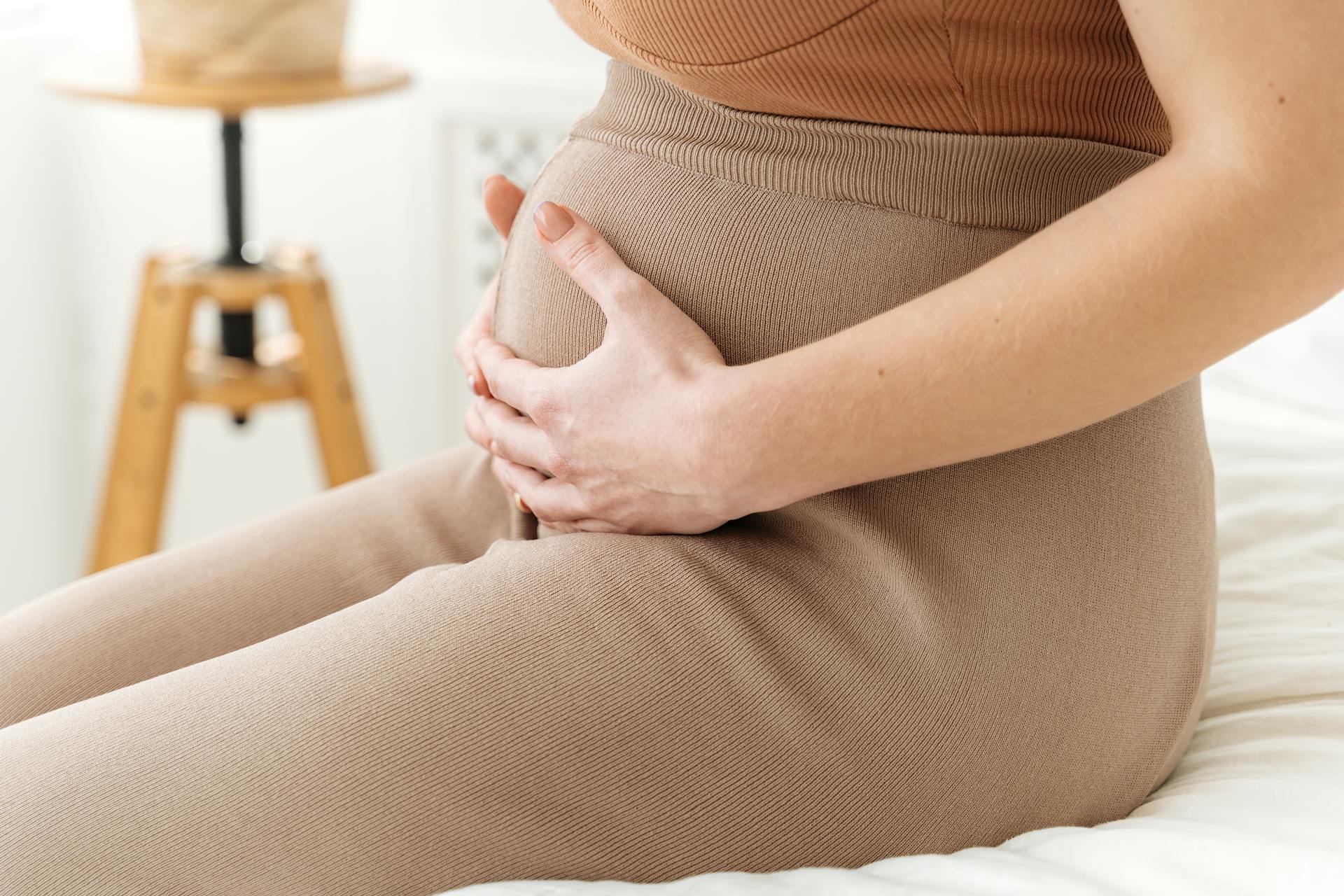 A pregnant woman touching her belly | Source: Pexels