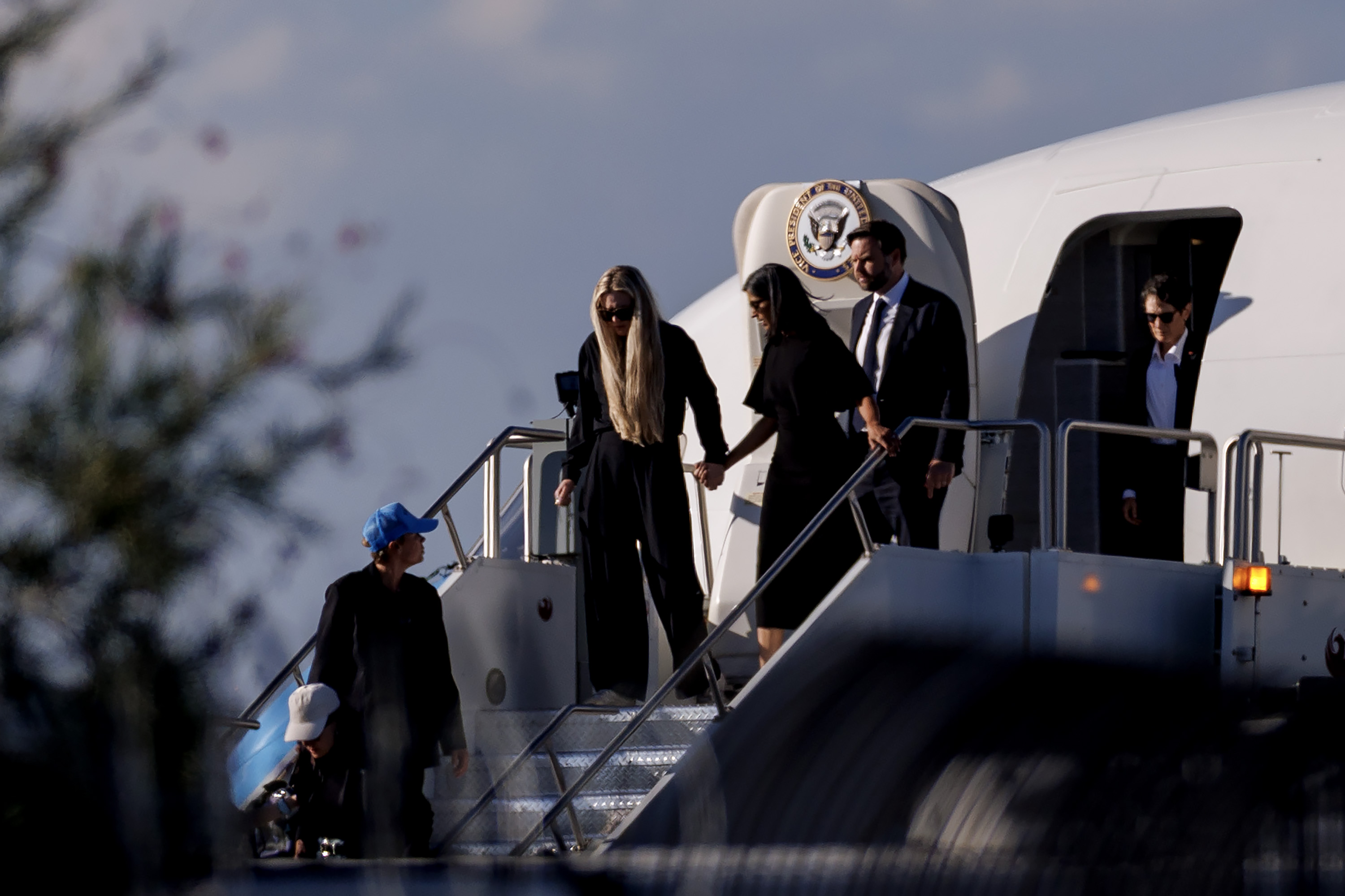 Vice President JD Vance (R), Second Lady Usha Vance (C), and Erika Kirk deplane Air Force Two while escorting the body of Charlie Kirk on September 11, 2025, in Phoenix, Arizona. | Source: Getty Images