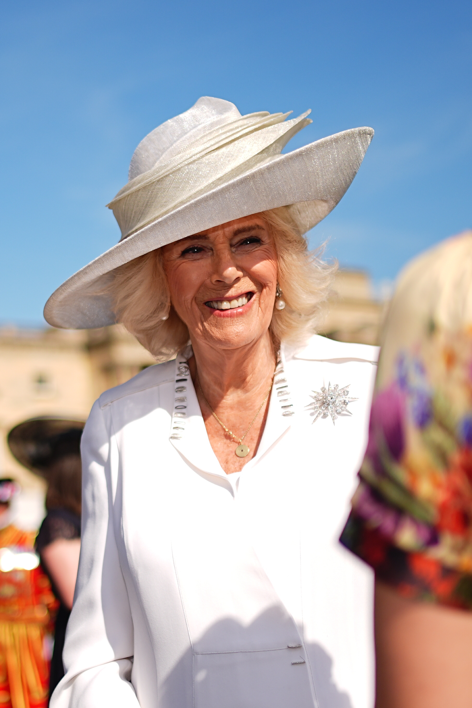 Queen Camilla attending the Education and Skills Garden Party at Buckingham Palace on May 14, 2025 in London, England. | Source: Getty Images