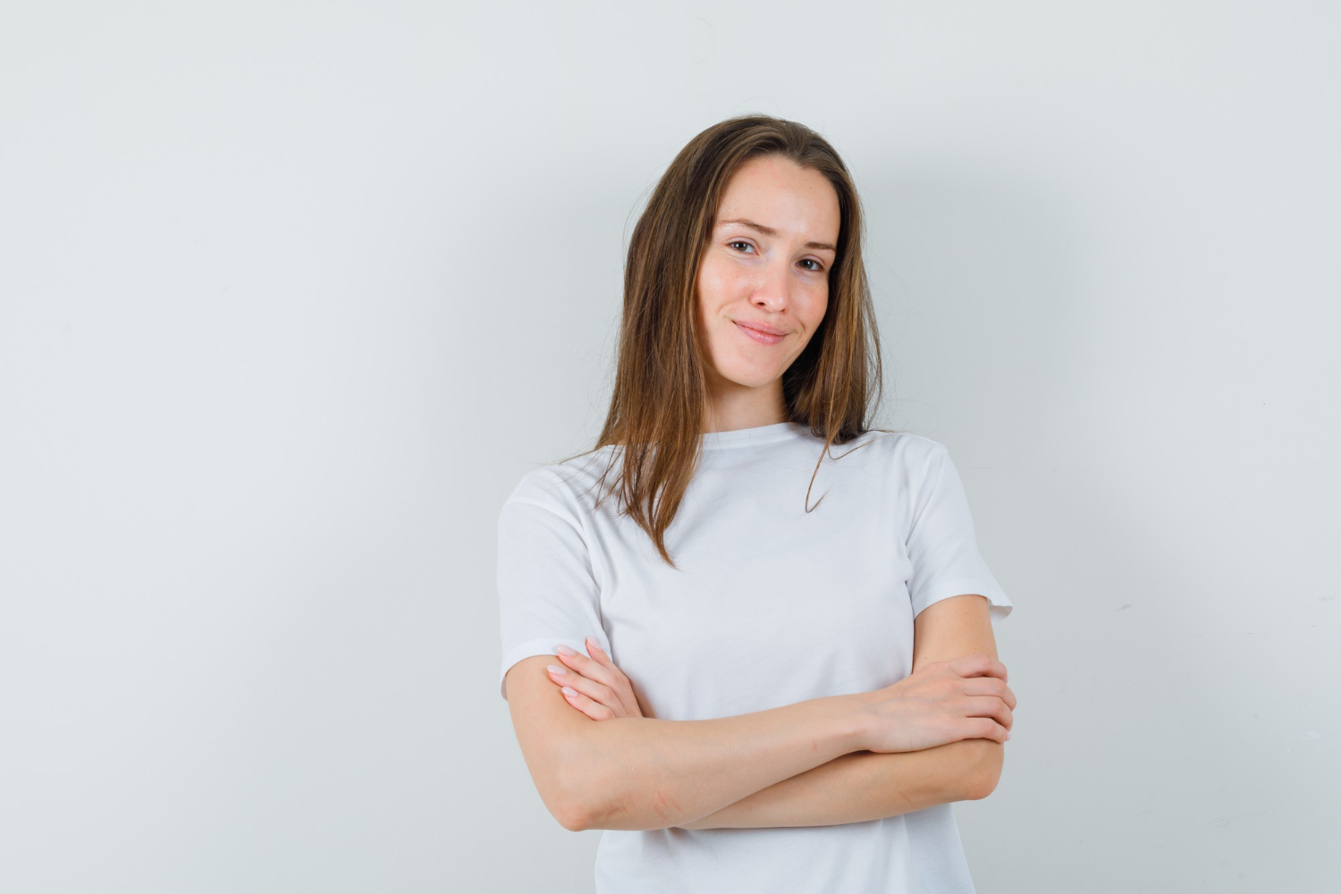 A confident woman with her arms crossed | Source: Freepik