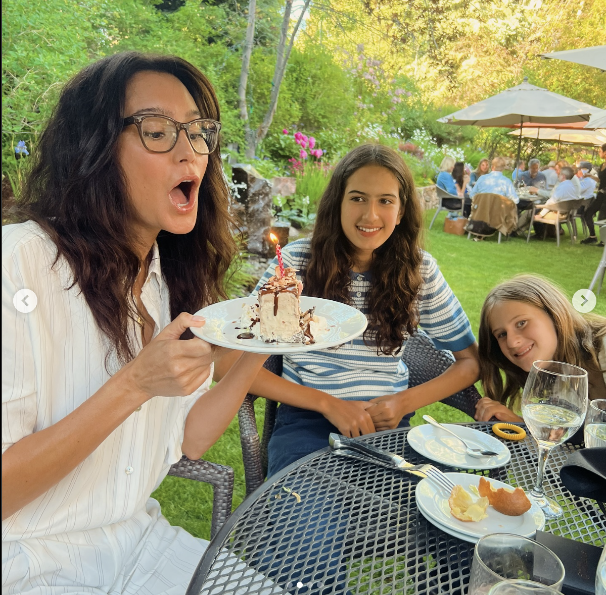 Emma Heming Willis poses with a slice of cake to mark her birthday, posted on June 19, 2025 | Source: Instagram/emmahemingwillis