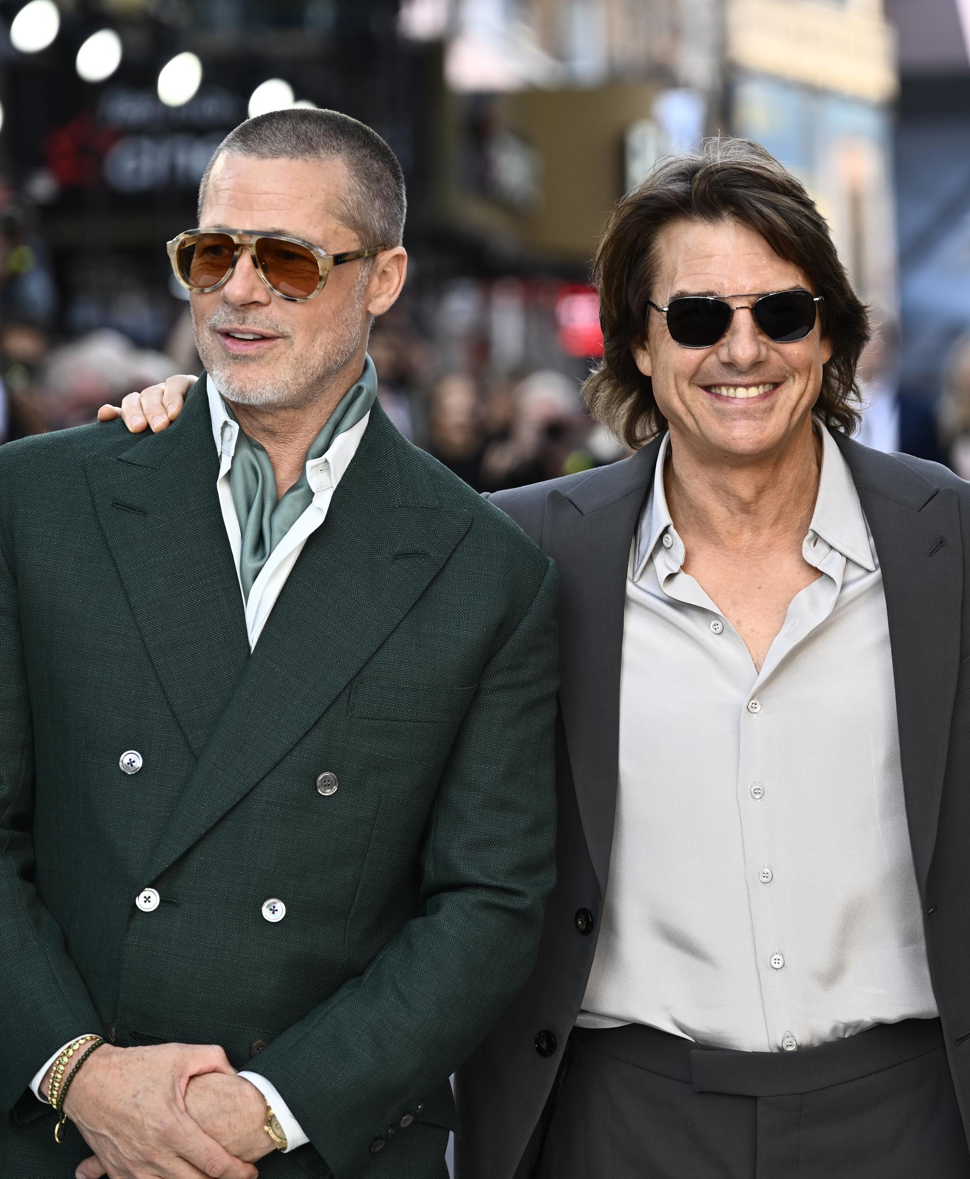 Brad Pitt and Tom Cruise pose together at the "F1: The Movie" premiere at Cineworld, Leicester Square on June 23, 2025 in London, England