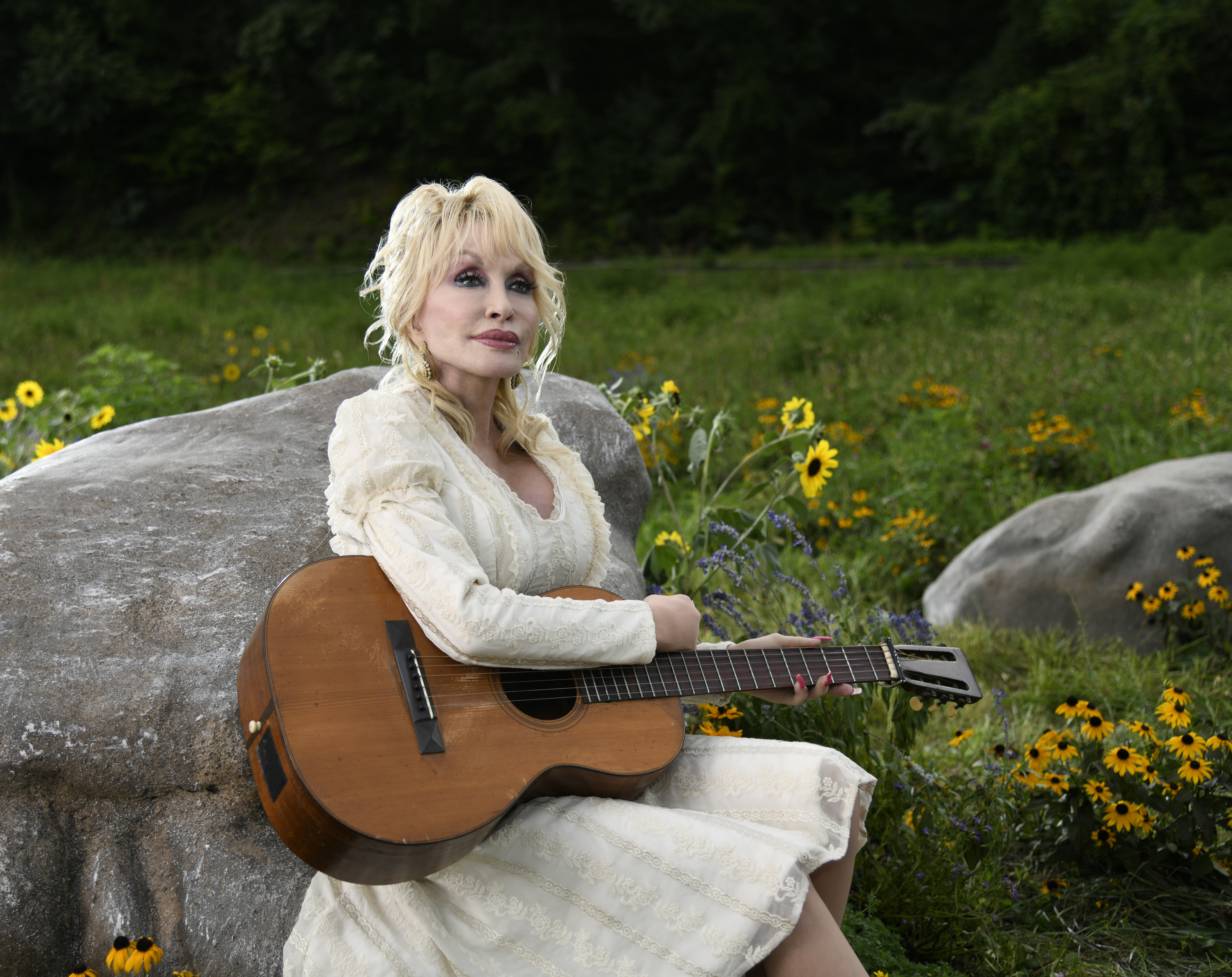 Dolly Parton poses for a photo for "Dolly Parton's Mountain Magic Christmas" in 2022. | Source: Getty Images