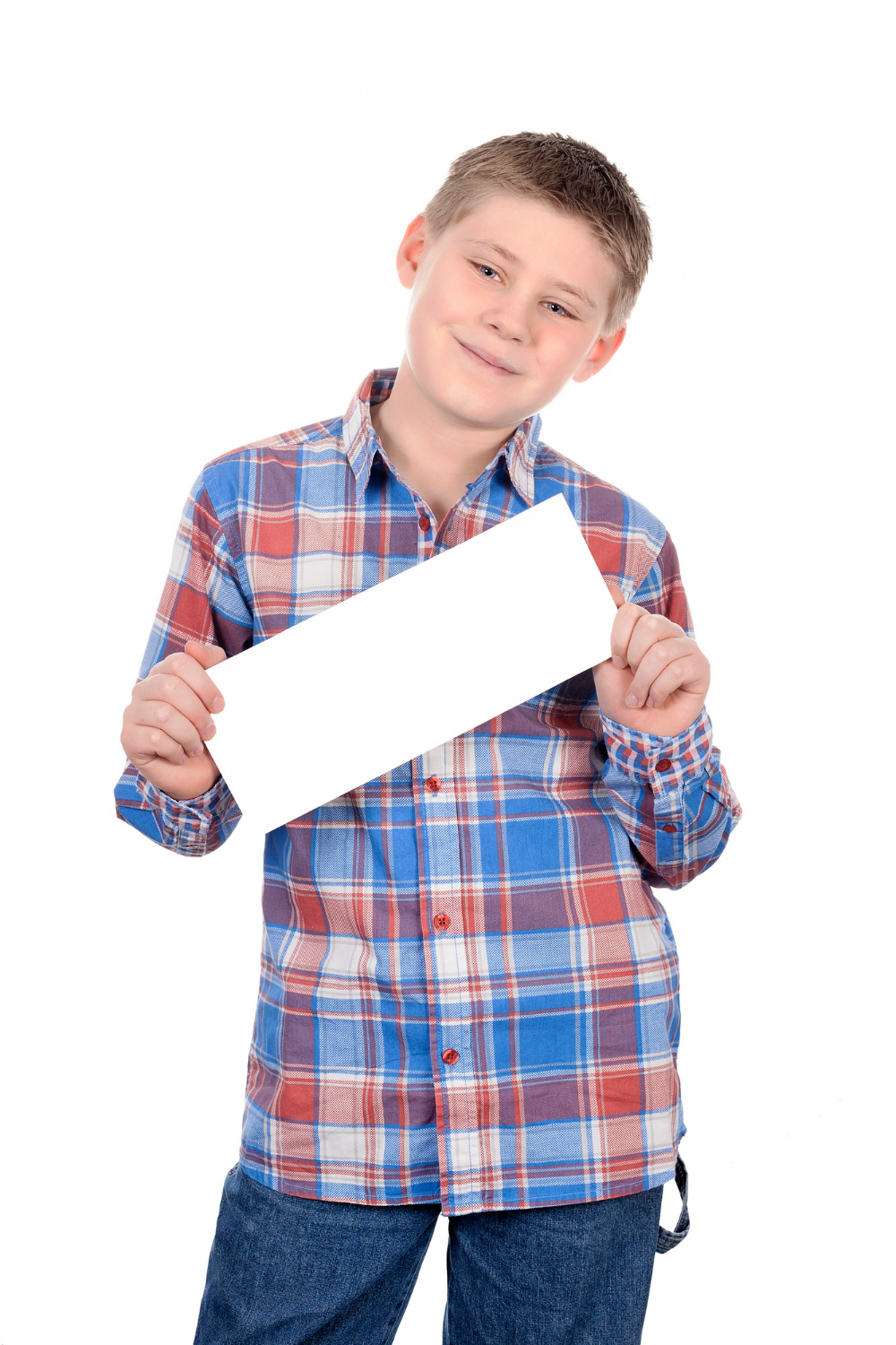 A smiling boy holding a plain white sheet of paper | Source: Freepik