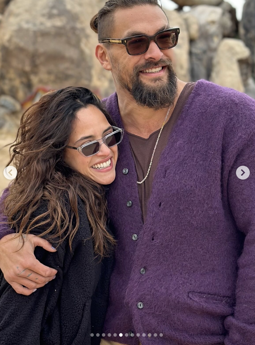 Jason Momoa and Adria Arjona share an embrace, posted on August 1, 2025. | Source: Instagram/adriaarjona