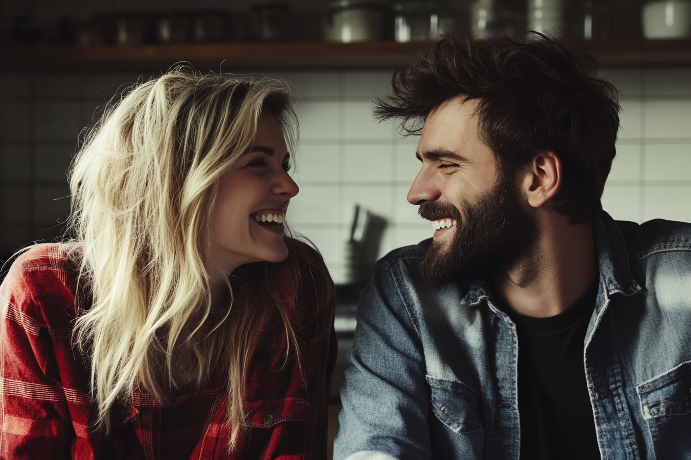 A couple laughing together in a kitchen | Source: Midjourney